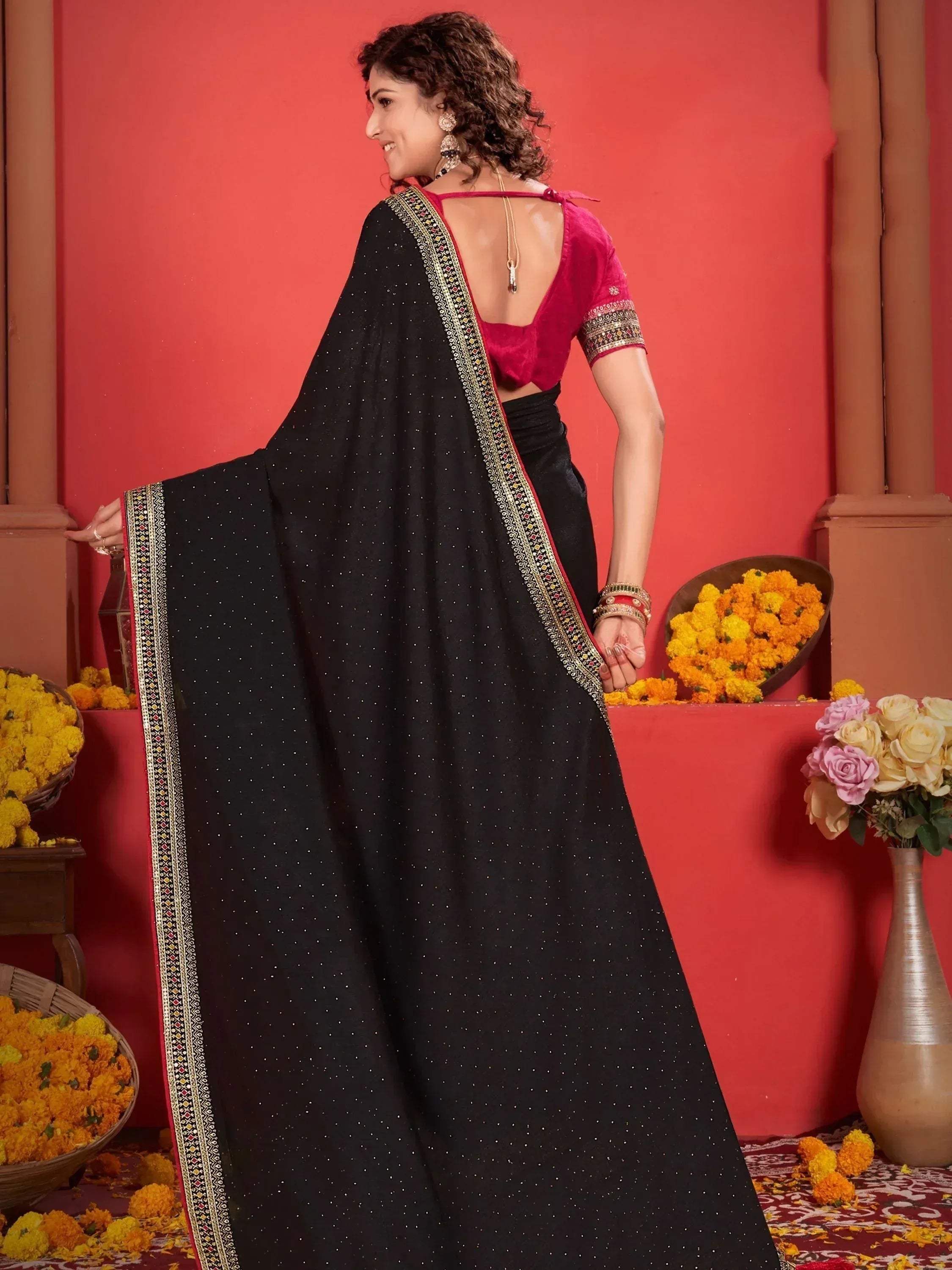 Black embroidered saree with red blouse, ethnic Indian wear for festive occasions