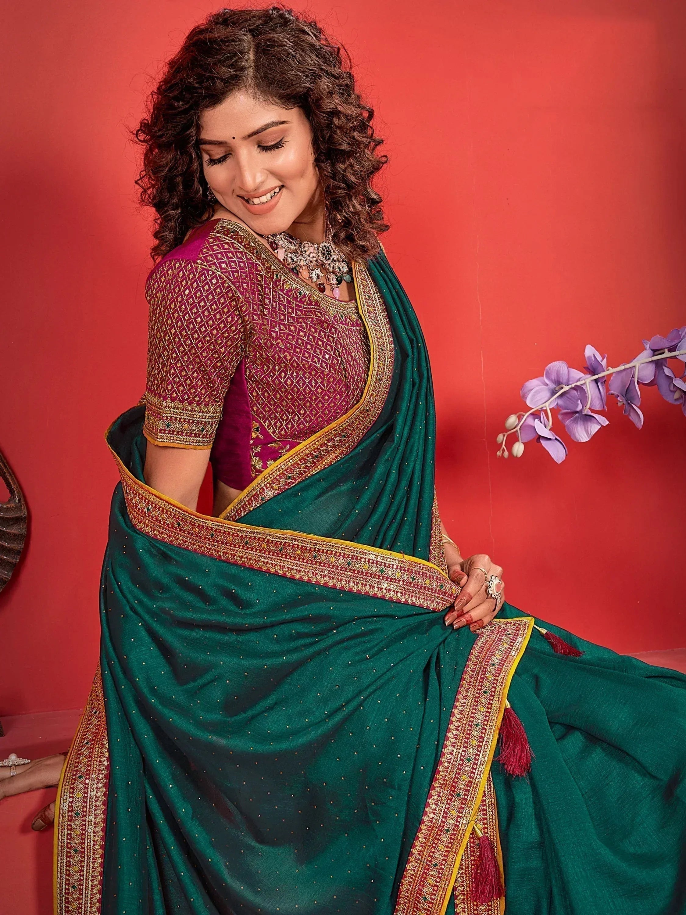 Woman in green saree with maroon embroidered blouse, festive Indian ethnic wear