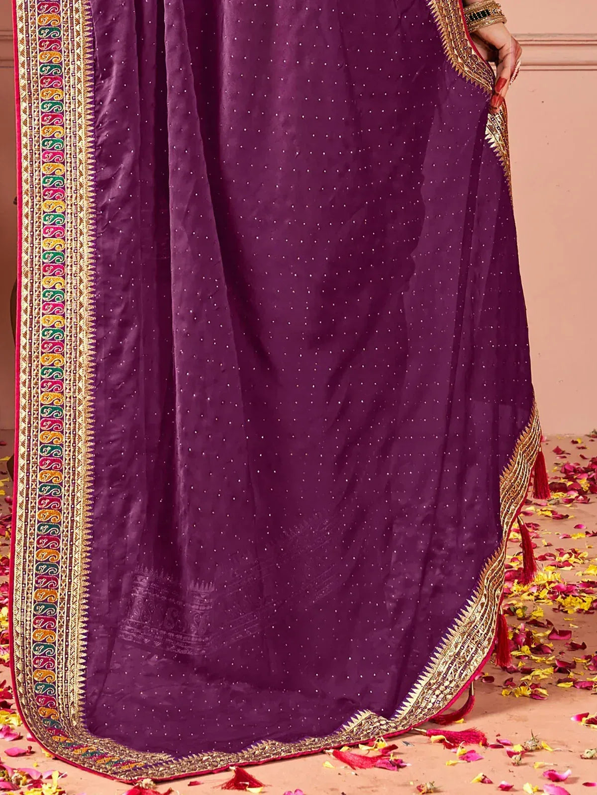 Purple ethnic saree with gold embroidery and colorful border, perfect for Indian occasions