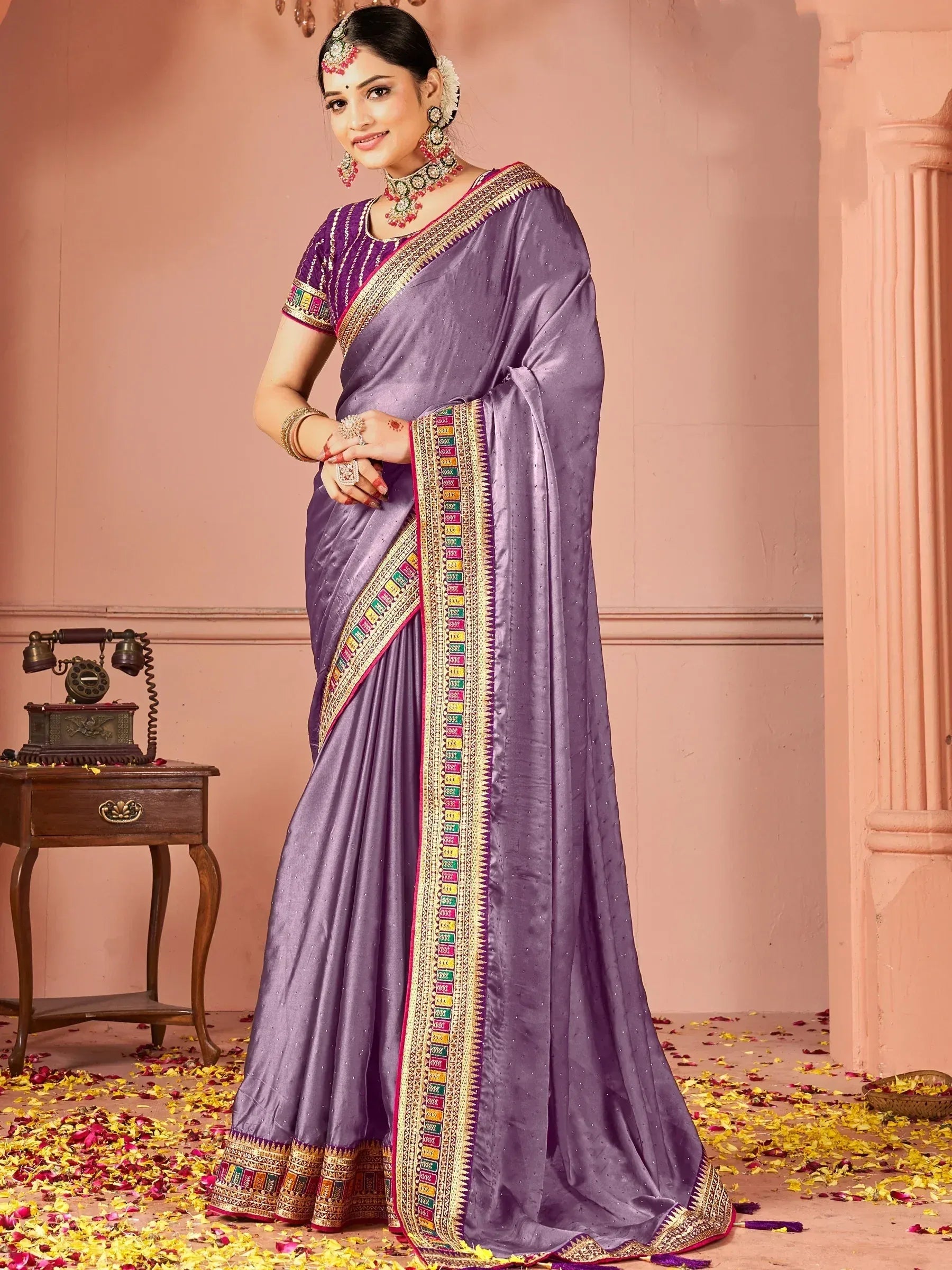Purple ethnic saree with colorful border, perfect for Indian weddings and festive occasions