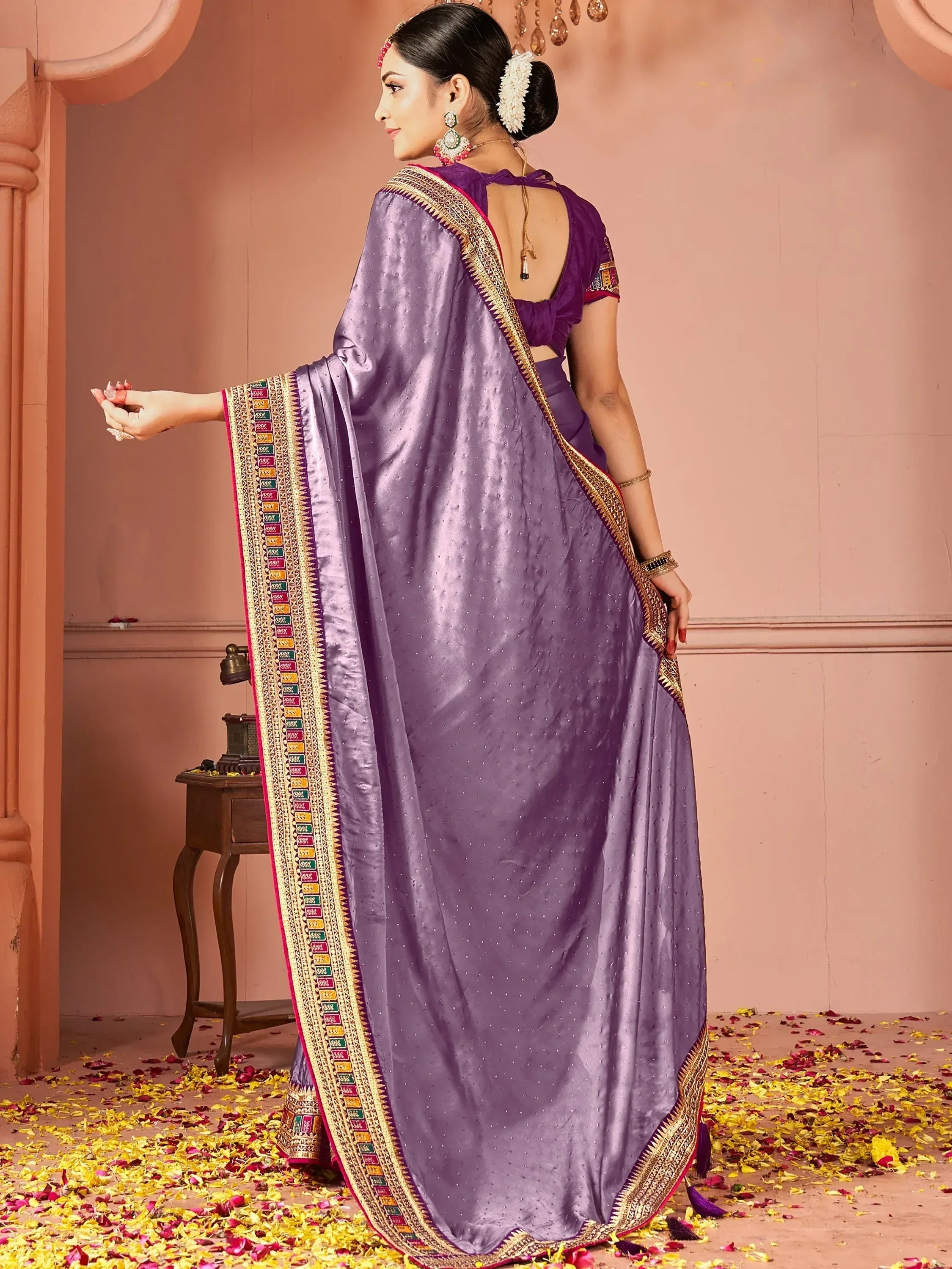 Purple designer saree with gold border and embellished blouse, perfect for Indian ethnic wear occasions