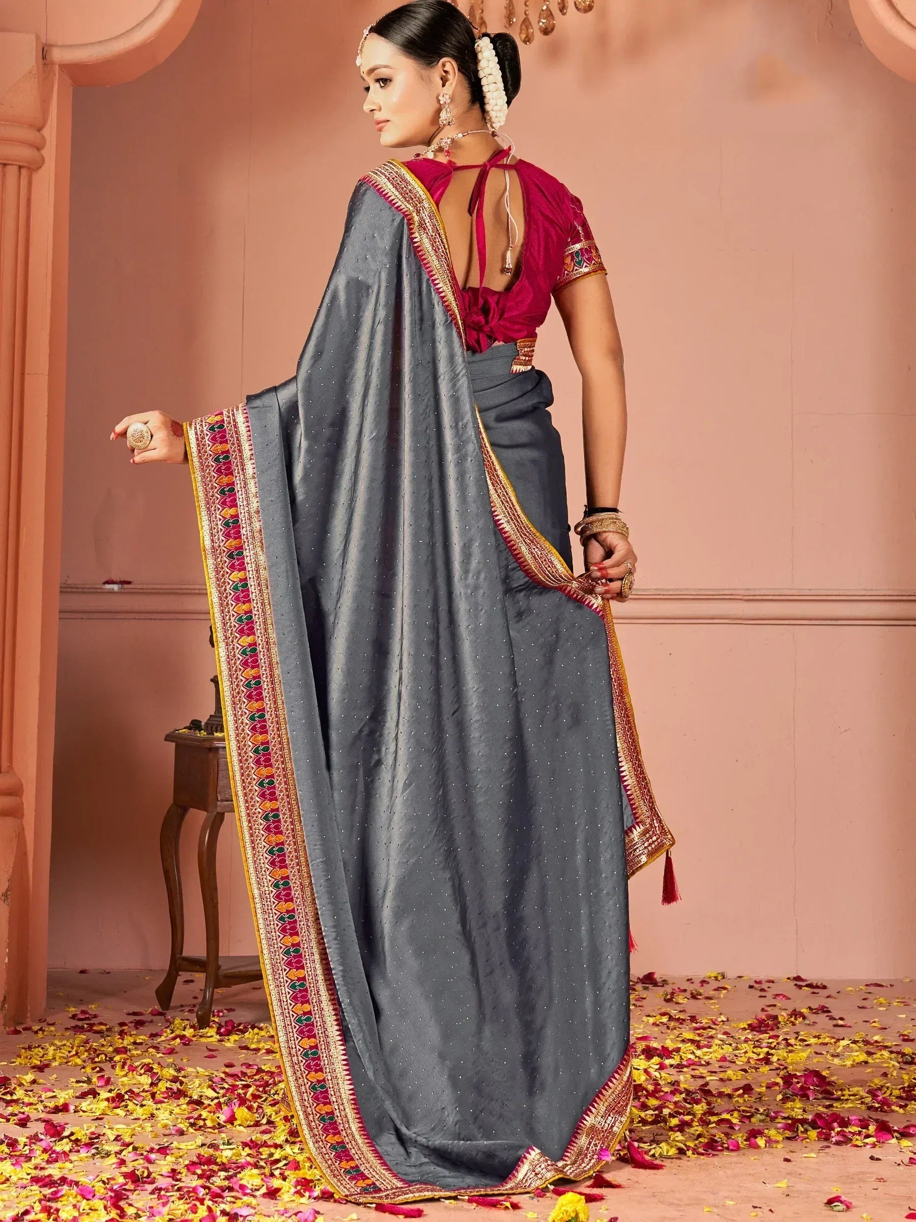 Grey saree with colorful border and pink blouse, styled for Indian ethnic wear