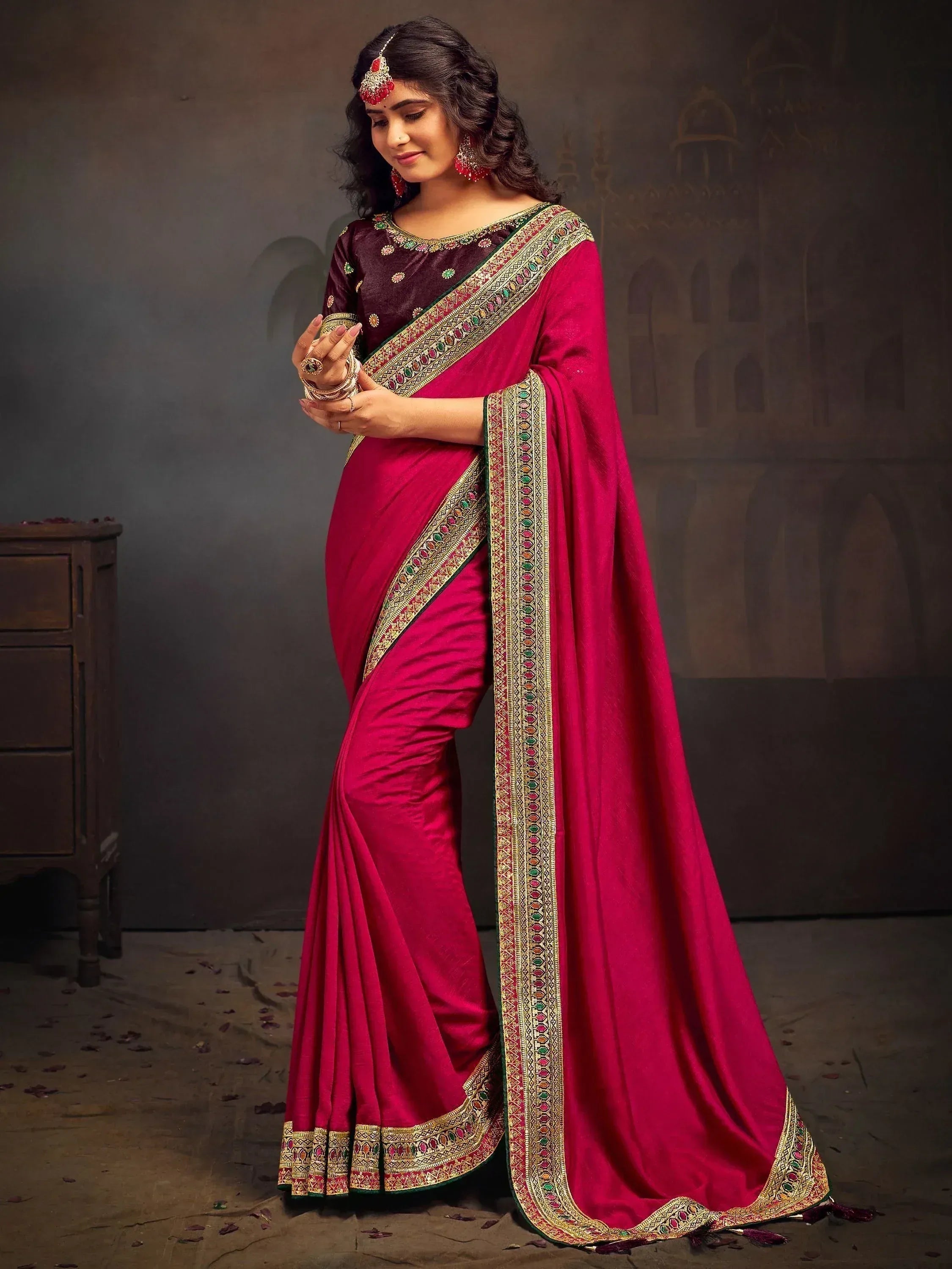 Elegant maroon saree with gold embroidery, perfect for Indian ethnic occasions and weddings.