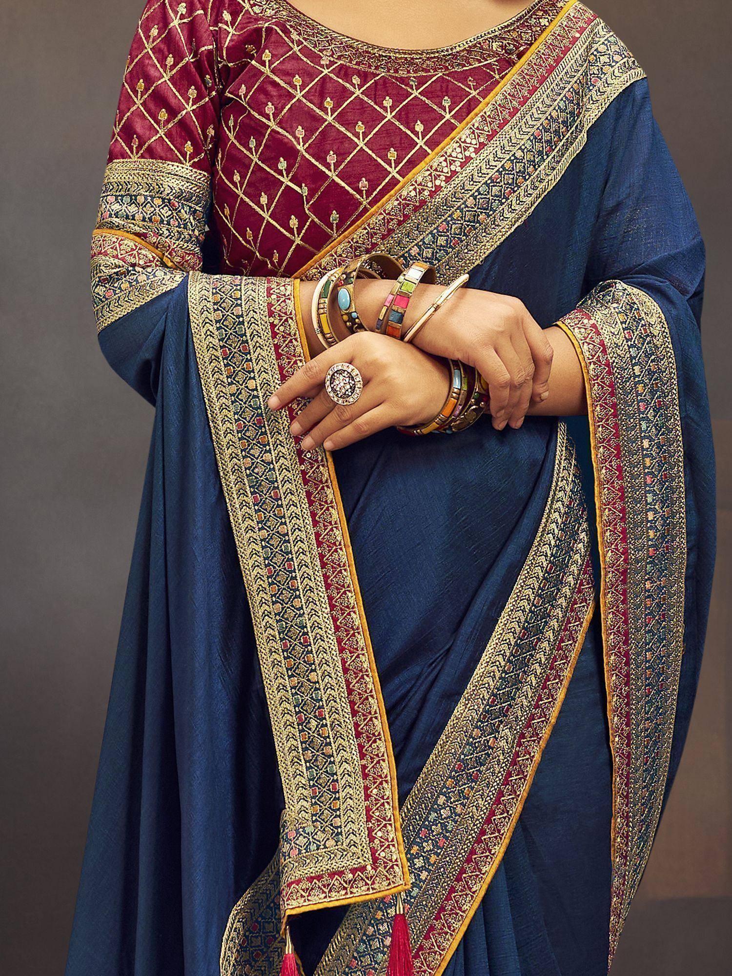 Blue saree with gold embroidery and maroon blouse, Indian ethnic wear with traditional jewelry