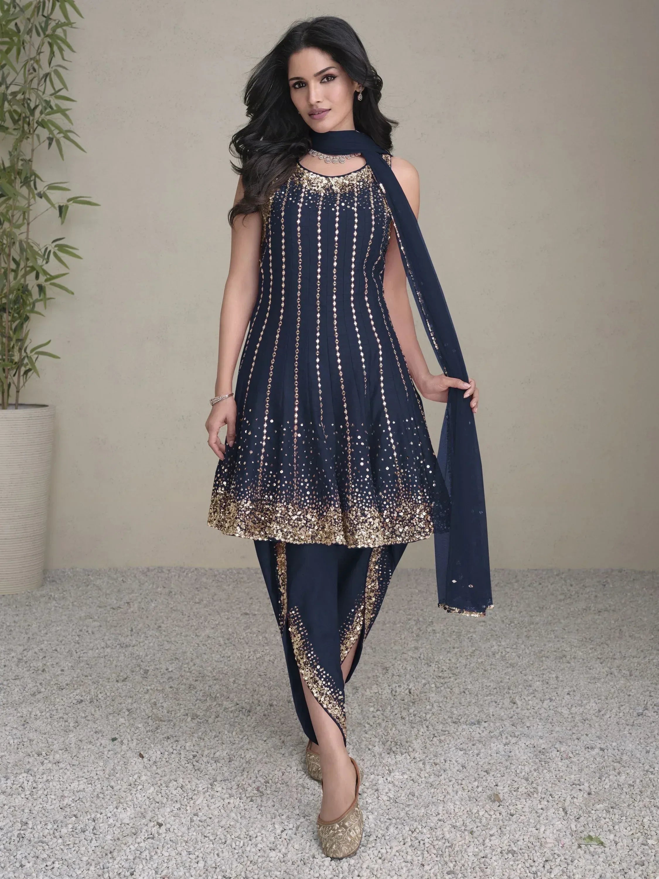 Navy blue ethnic salwar kameez with gold sequin work, perfect for festive occasions and weddings