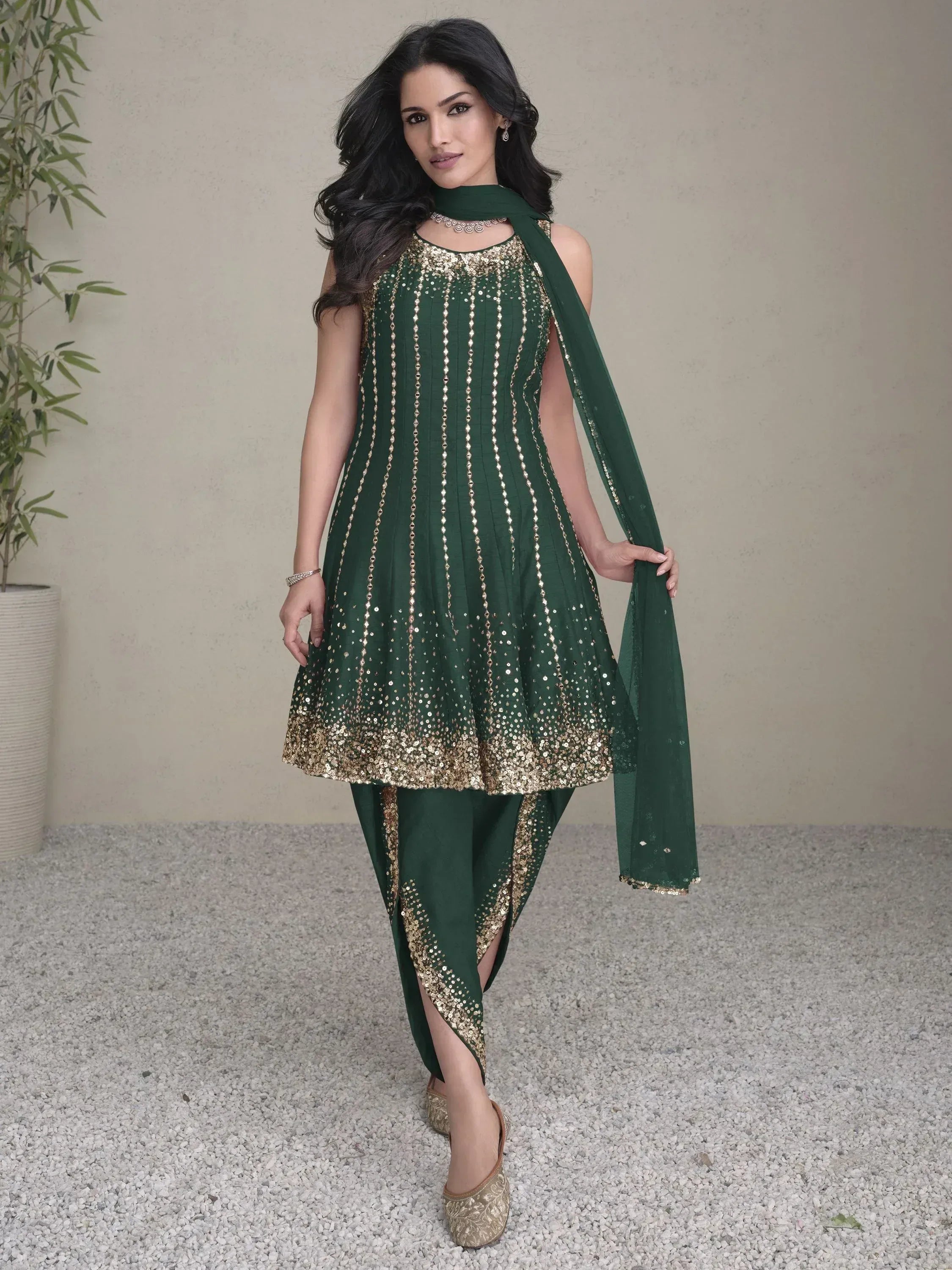 Emerald green sequin salwar kameez with gold detailing, perfect for festive Indian ethnic wear