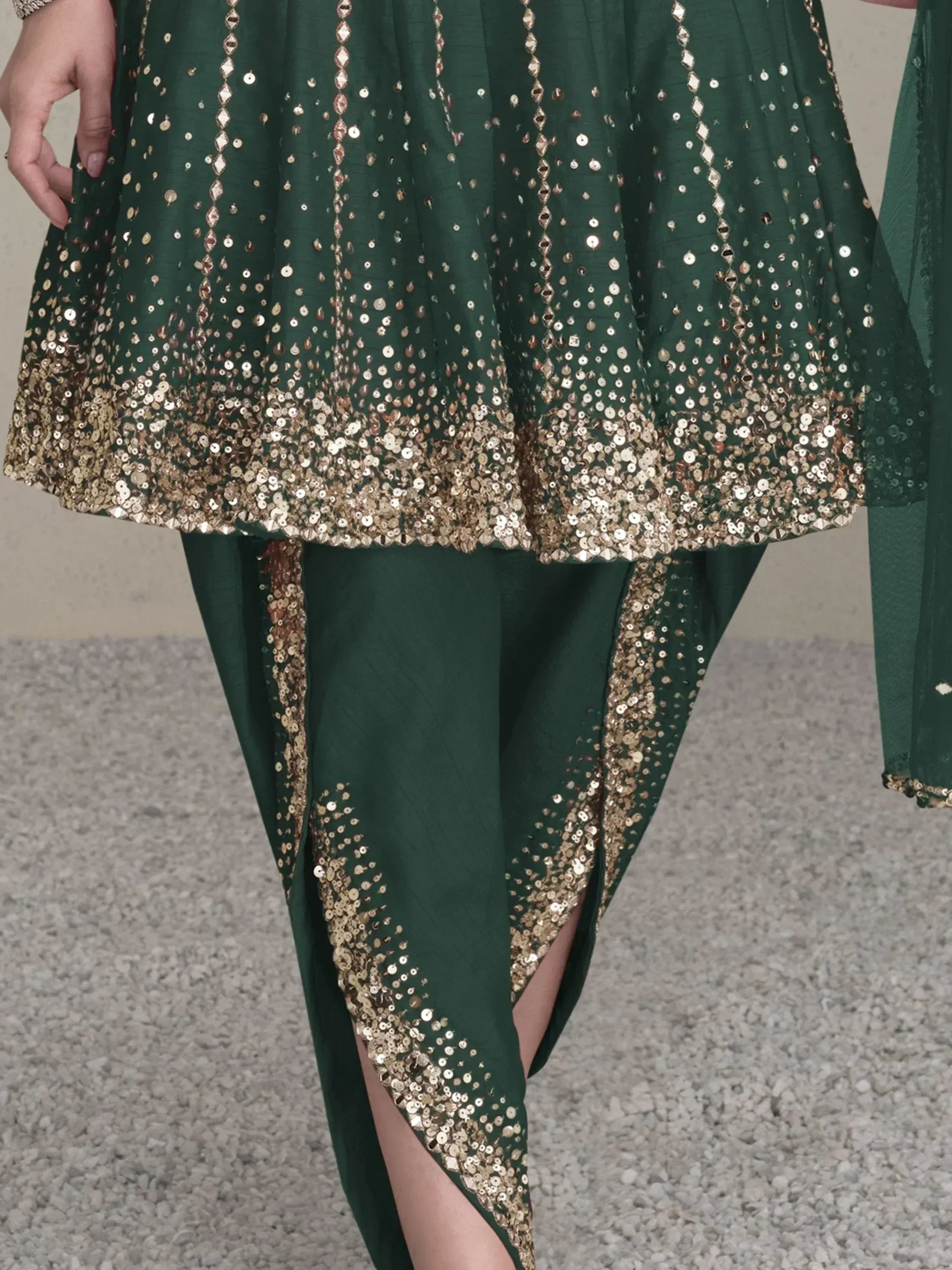 Emerald green ethnic gown with gold sequin embroidery, perfect for Indian festive occasions.