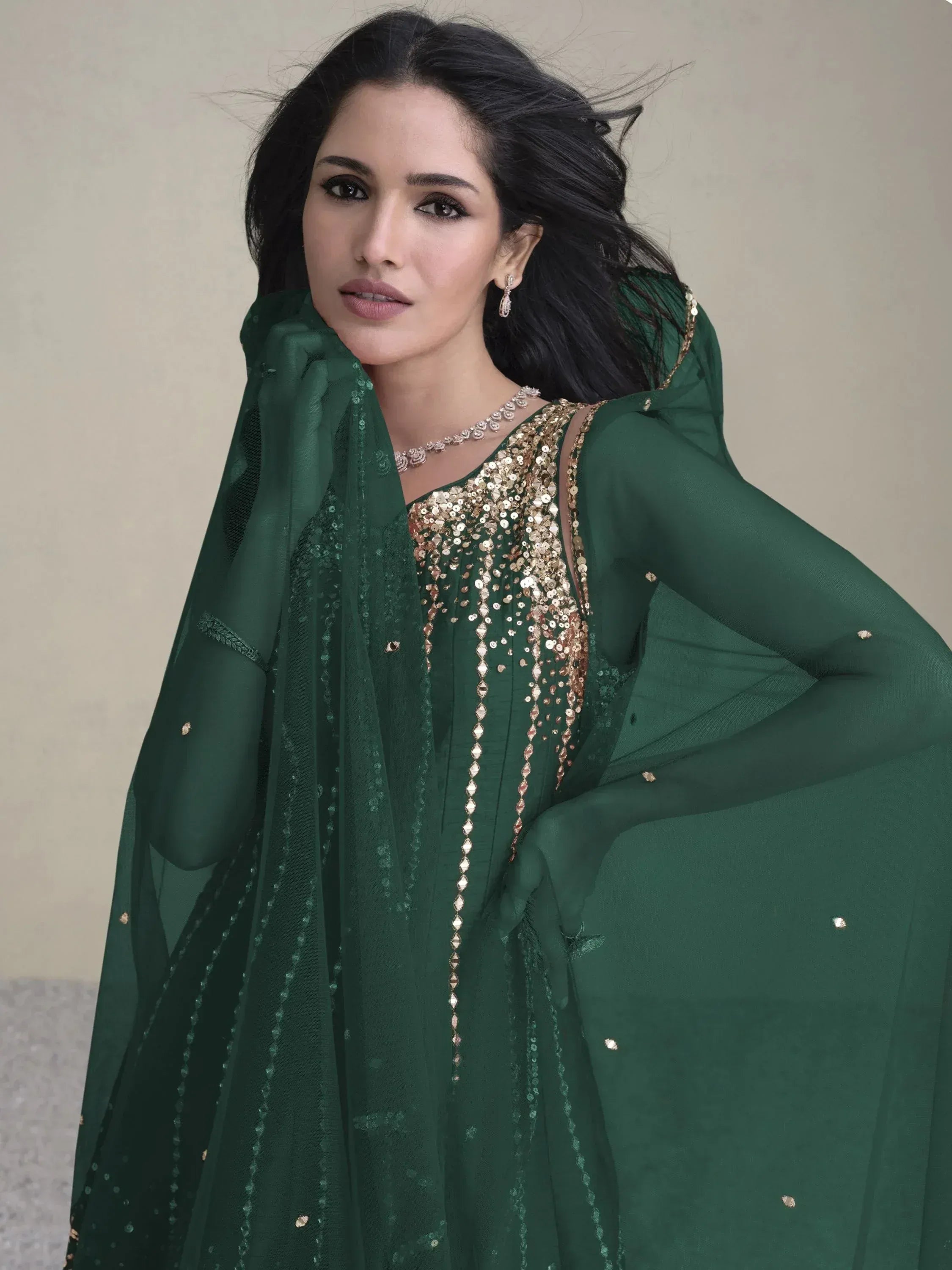Elegant green ethnic gown with gold sequin embroidery and sheer dupatta for Indian wear