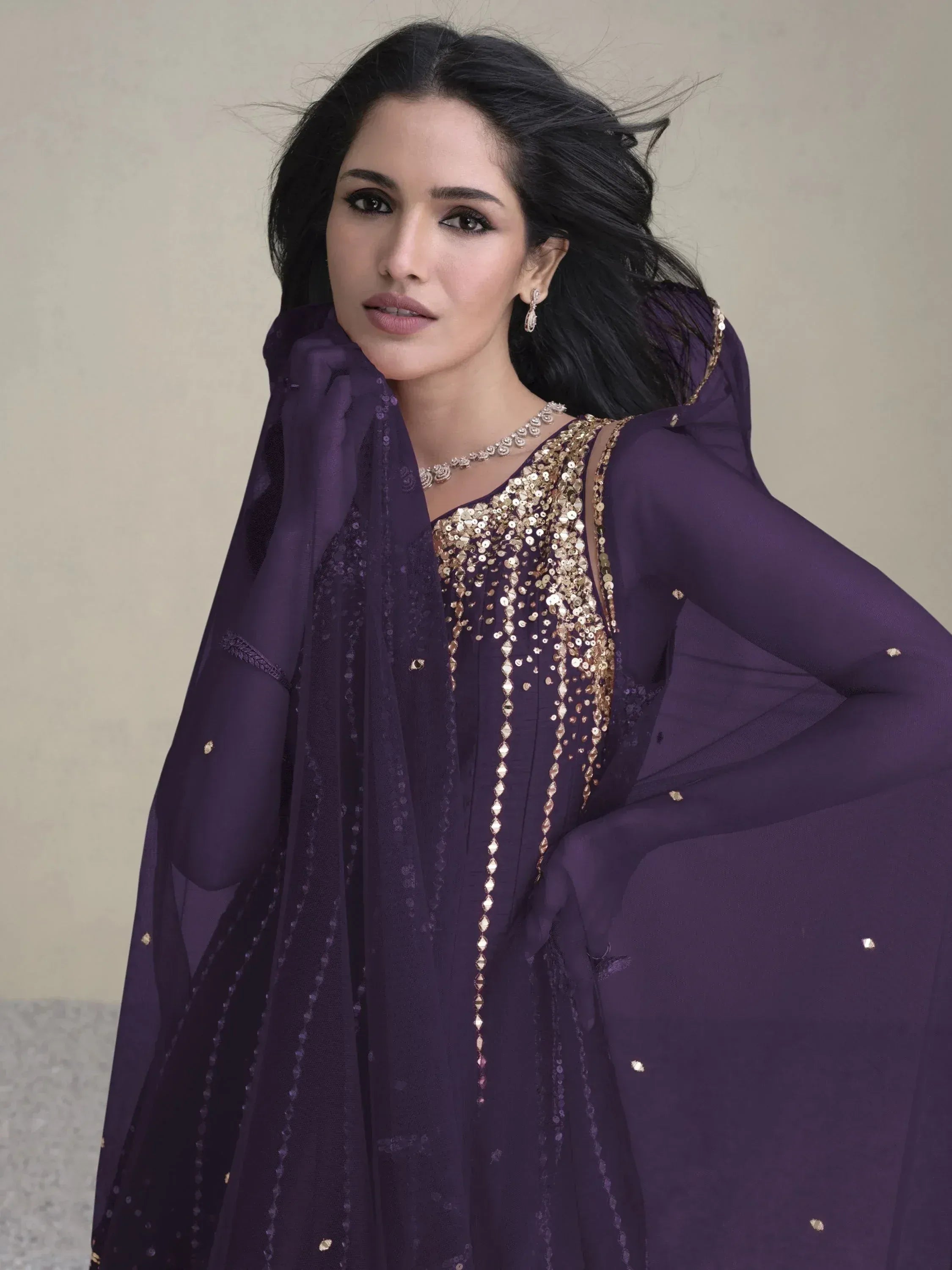 Purple ethnic gown with gold sequin embroidery, perfect for Indian occasions and festive wear.