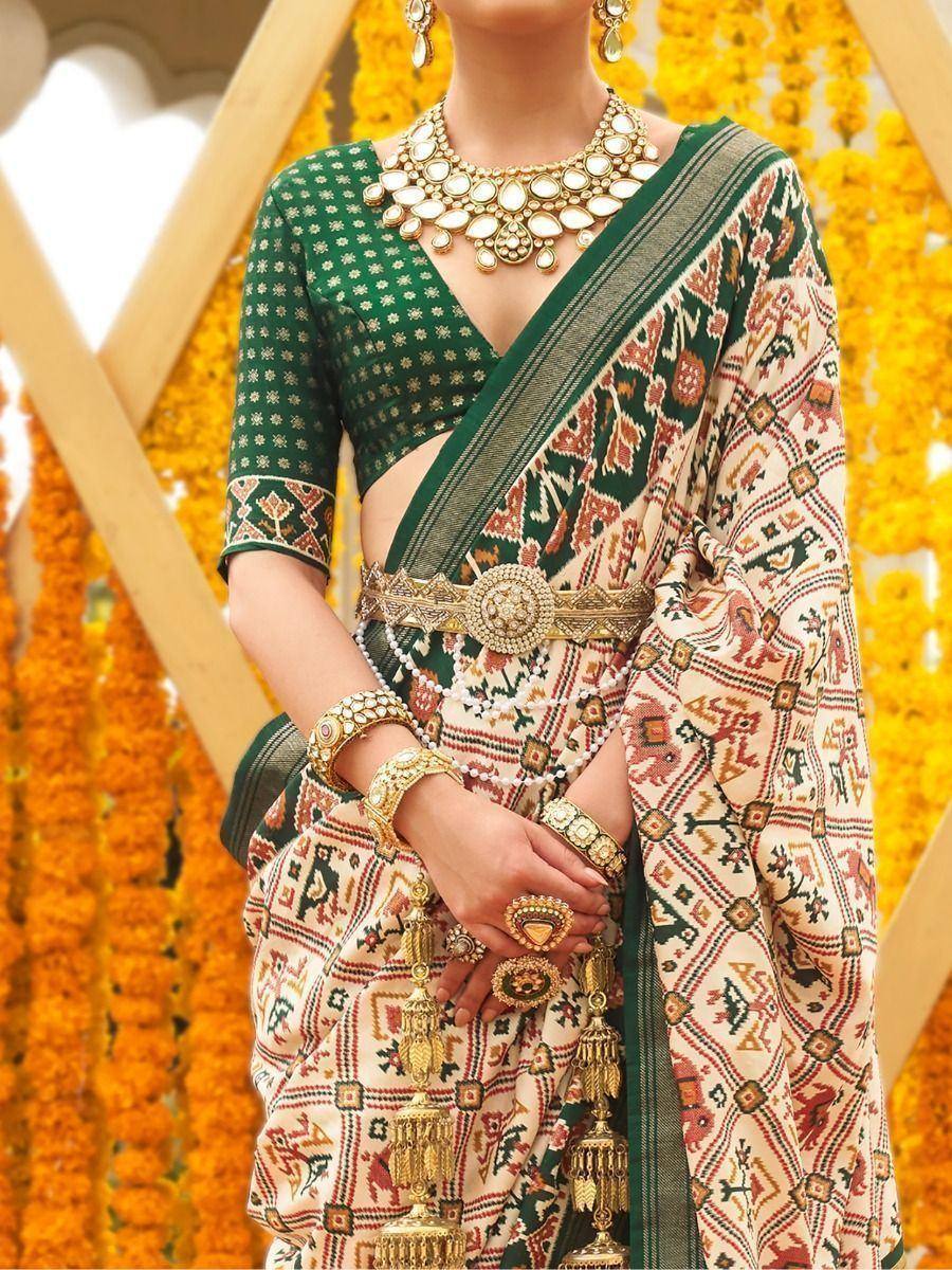Green printed saree with ethnic jewelry, perfect for Indian weddings and festive occasions
