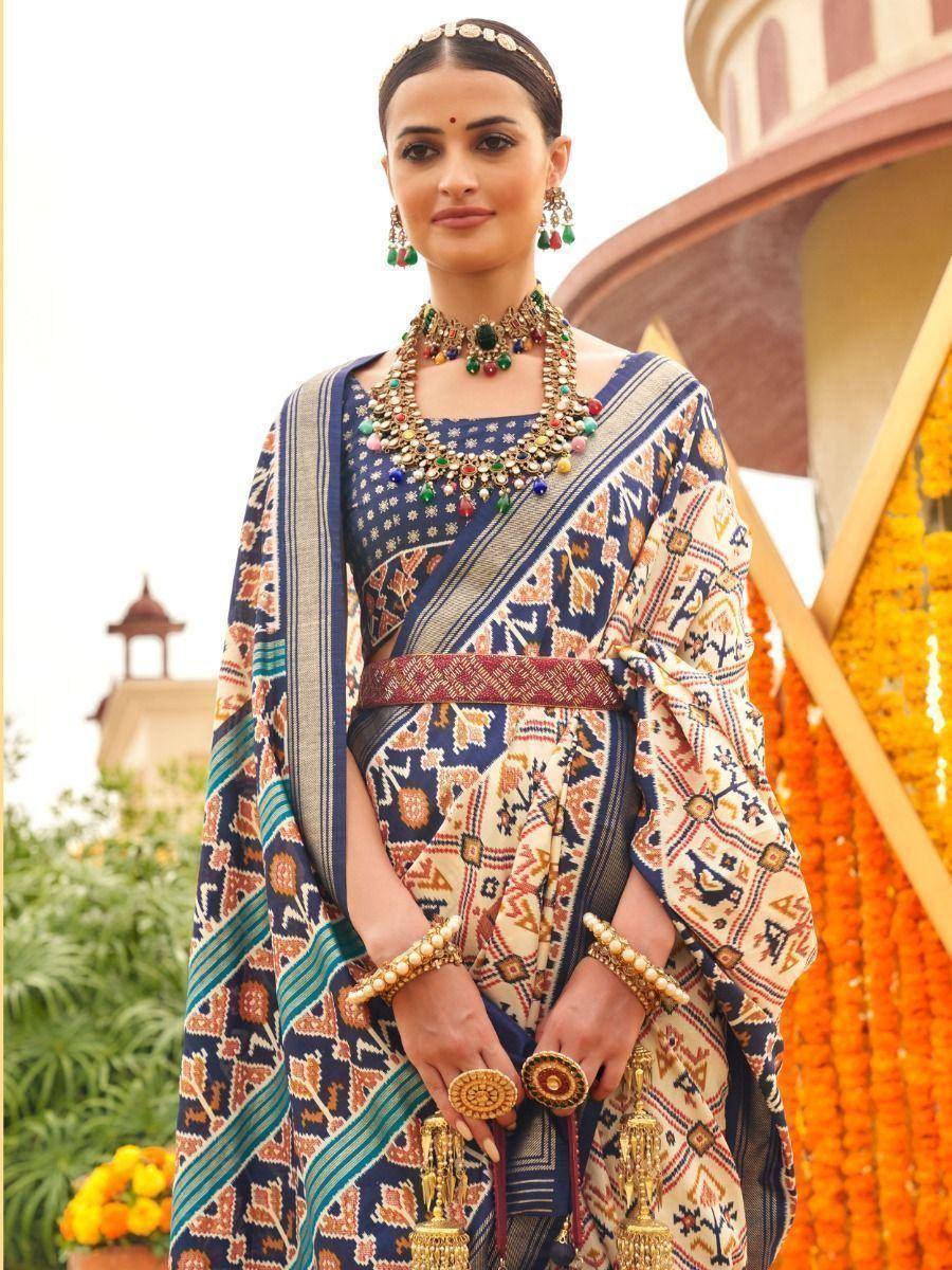 Woman in printed ethnic saree with statement jewelry, perfect for Indian festivals and occasions