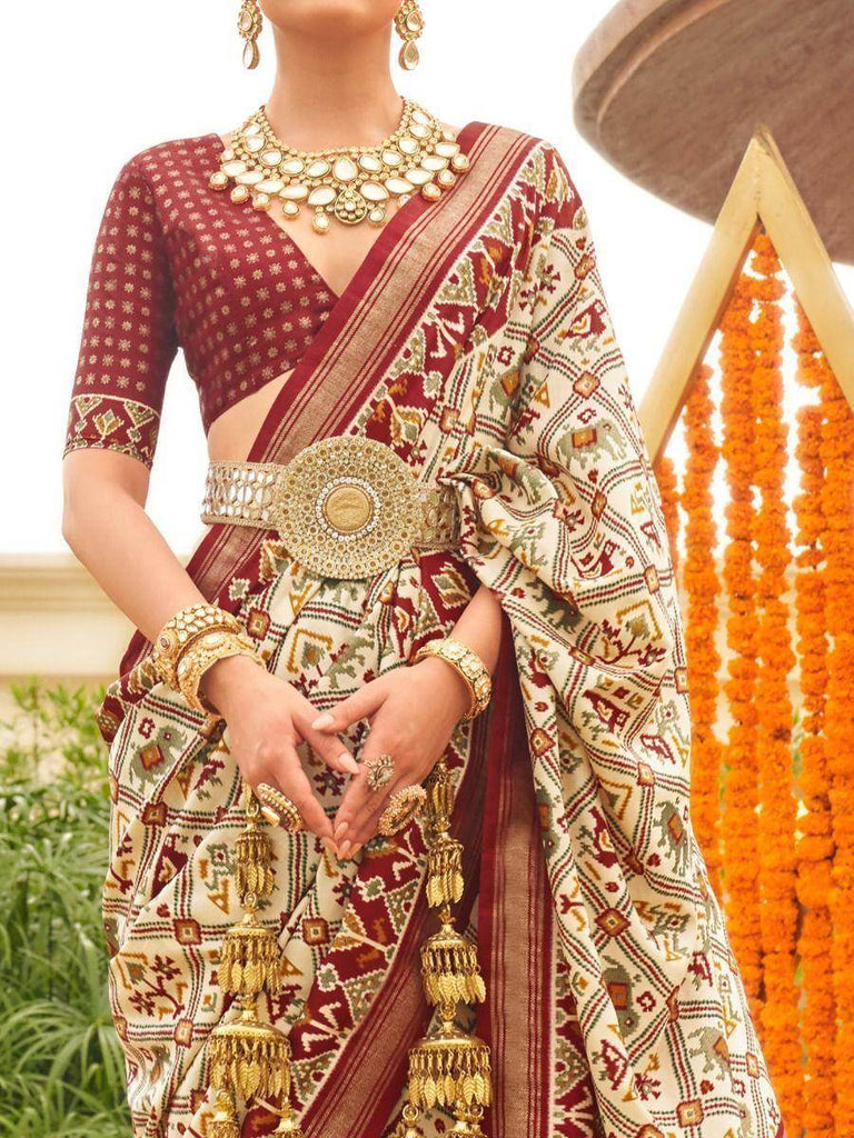 Marvelous Cream & Maroon Patola Printed Silk Traditional Saree