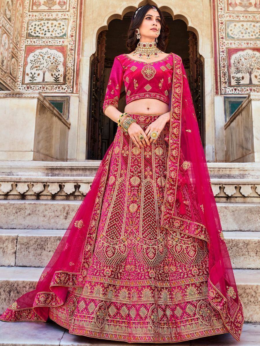 Pink embroidered lehenga choli with gold detailing, perfect for Indian weddings and festive occasions.