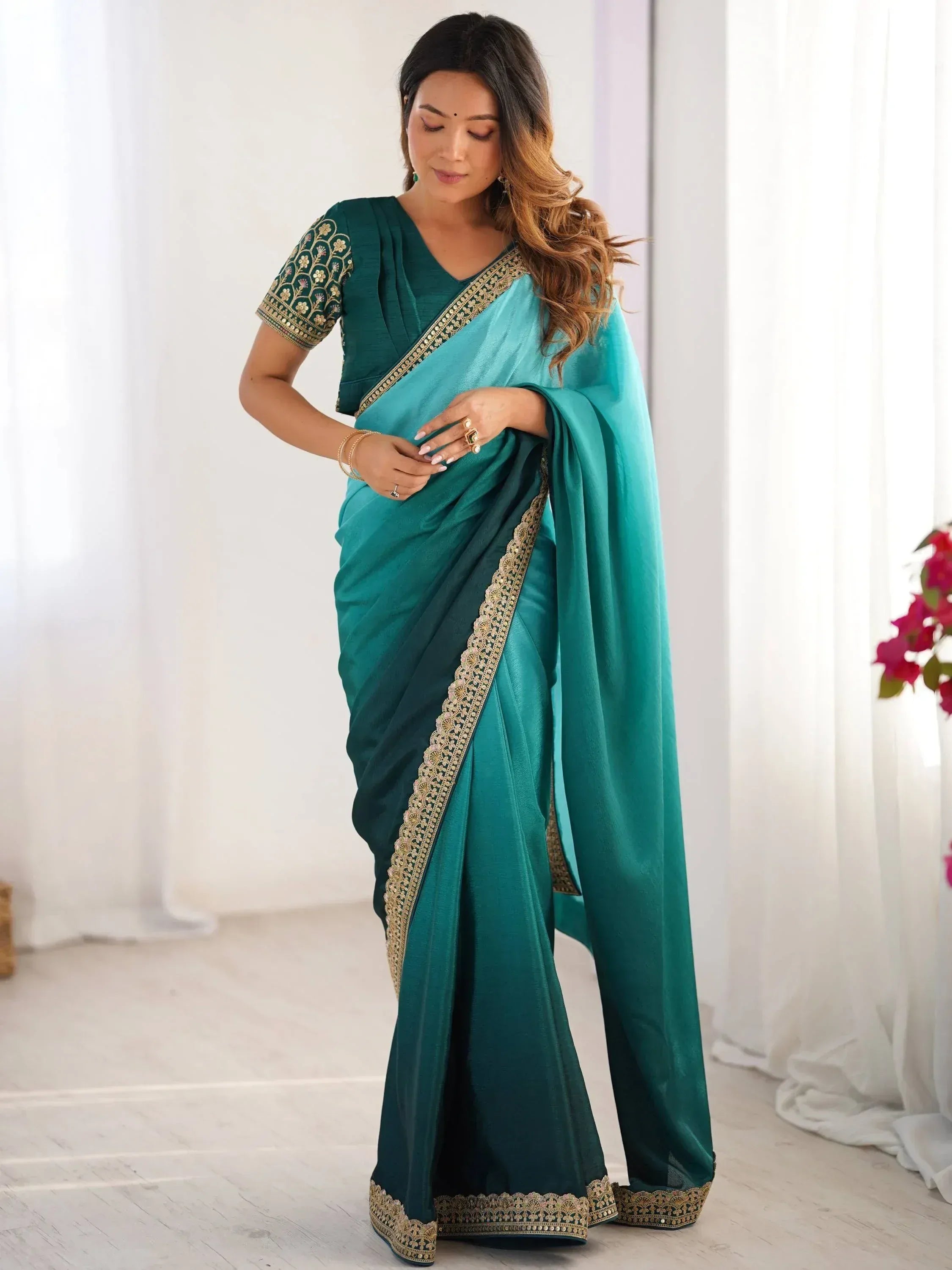 Emerald green saree with gold embroidery, perfect for Indian ethnic wear and festive occasions.