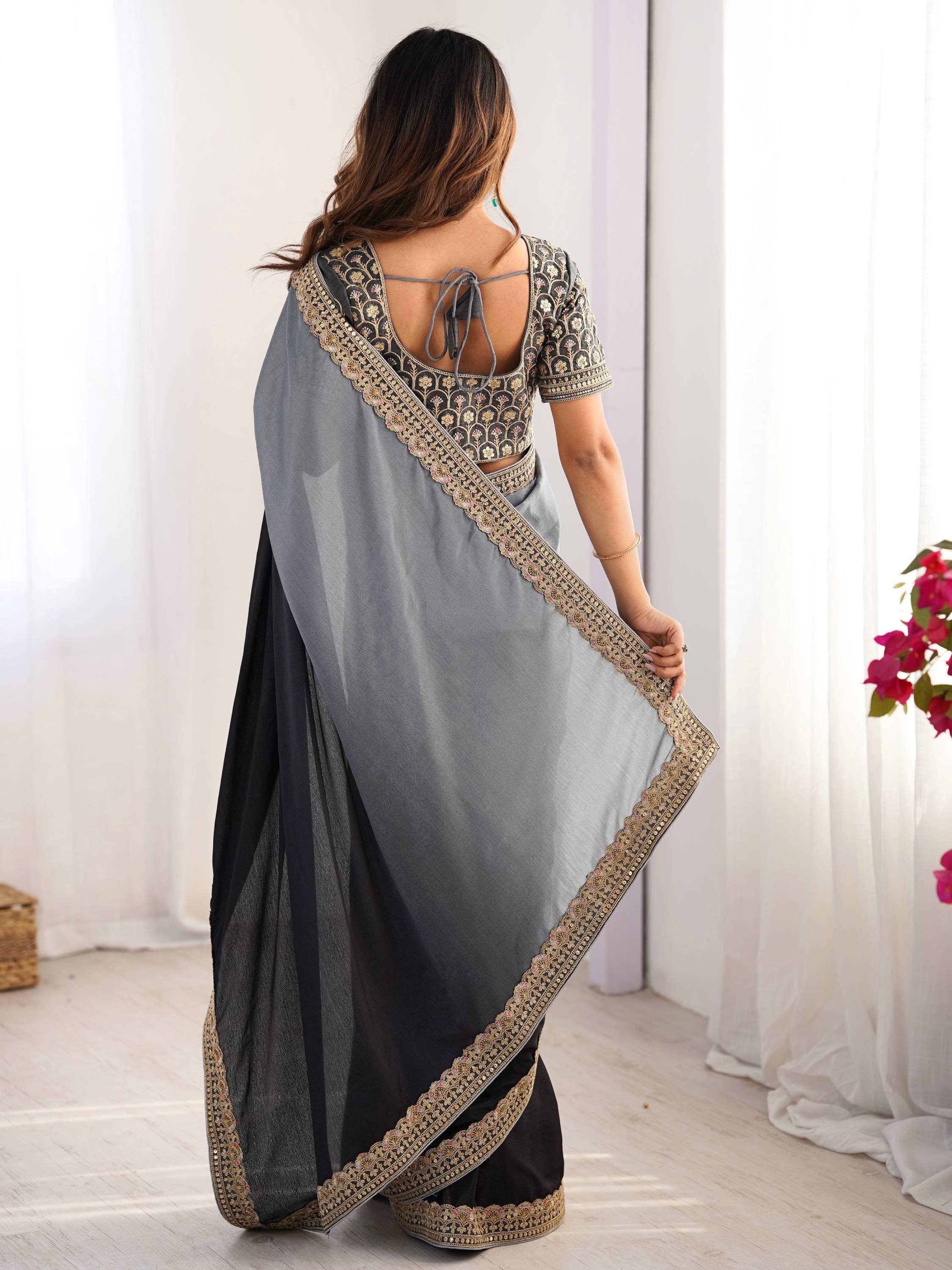 Grey and black embroidered saree with floral blouse, perfect for Indian ethnic wear occasions.