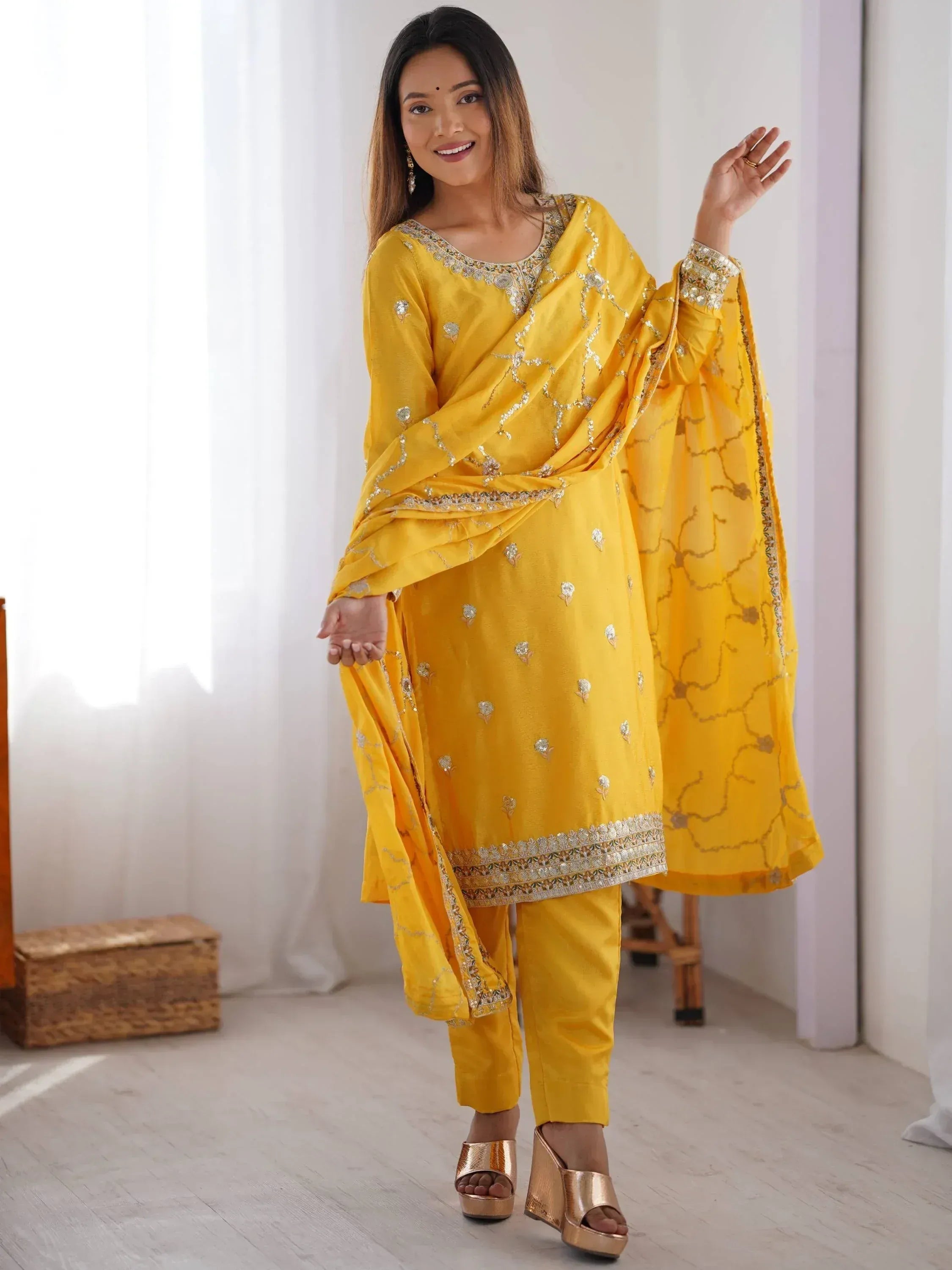 Yellow embroidered salwar kameez with matching dupatta, perfect for festive occasions and Indian ethnic wear.