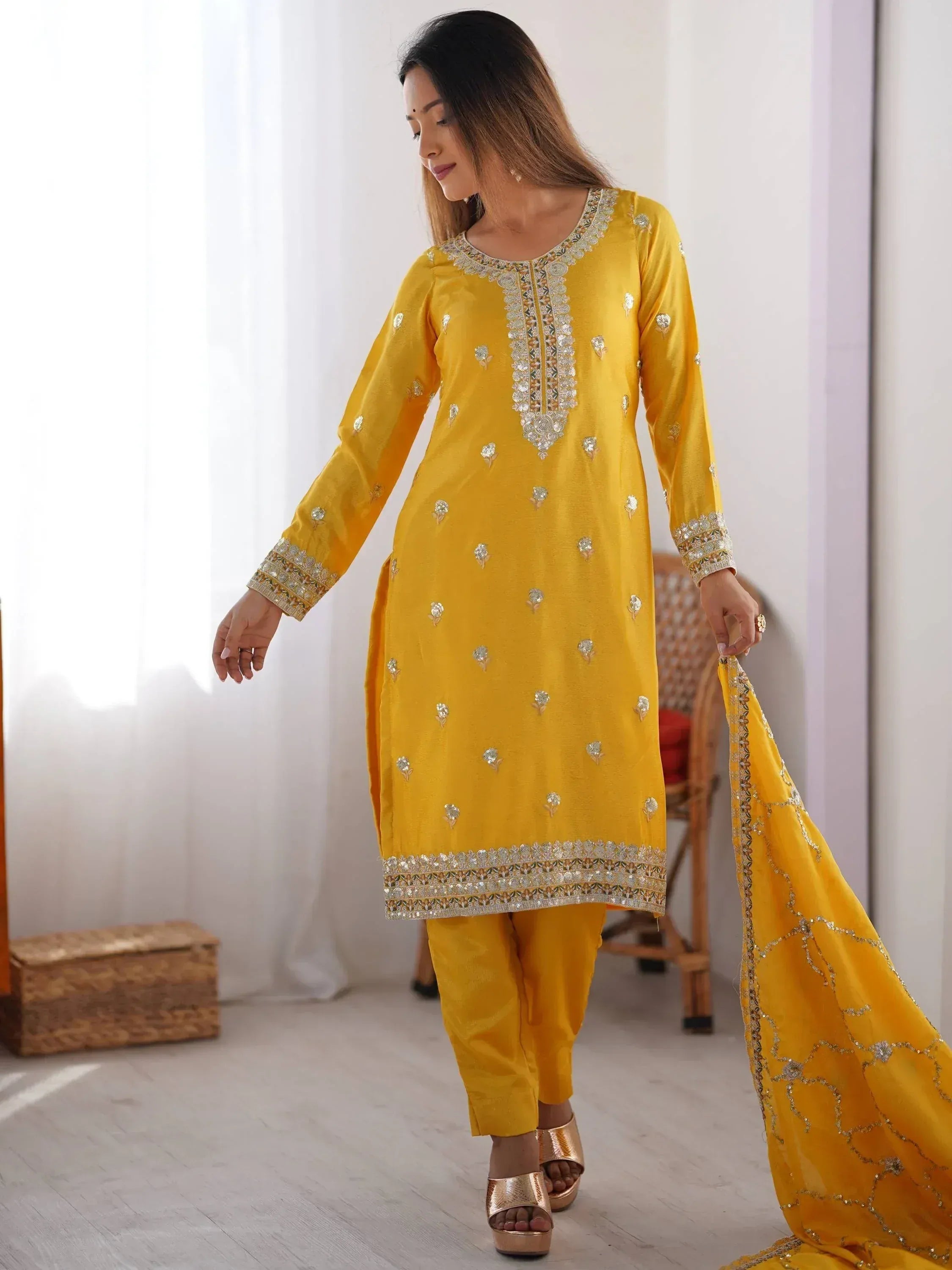 Yellow embroidered salwar kameez with matching dupatta, perfect for festive occasions