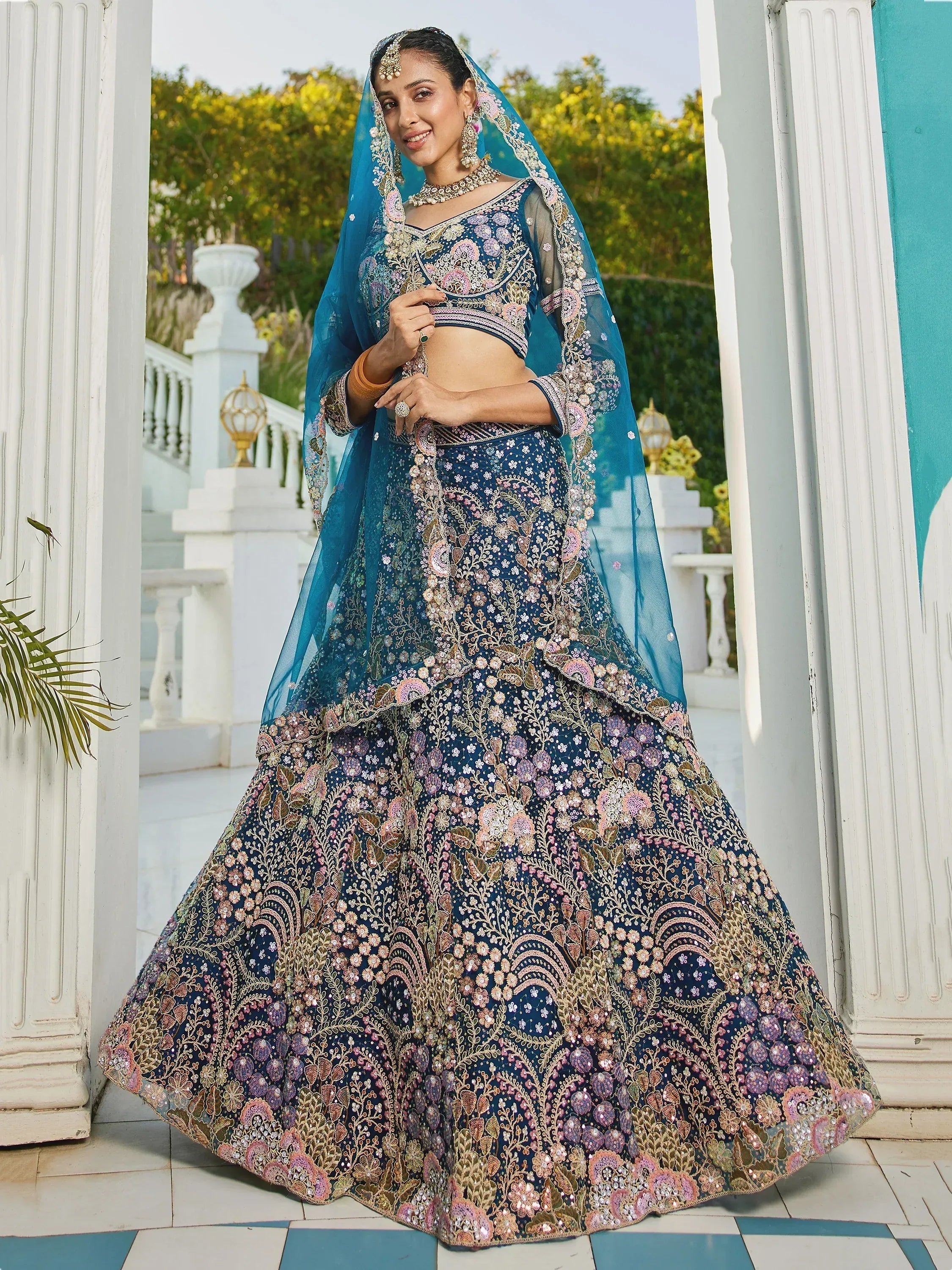 Elegant blue lehenga choli with floral embroidery and matching dupatta, perfect for Indian weddings and festive occasions.