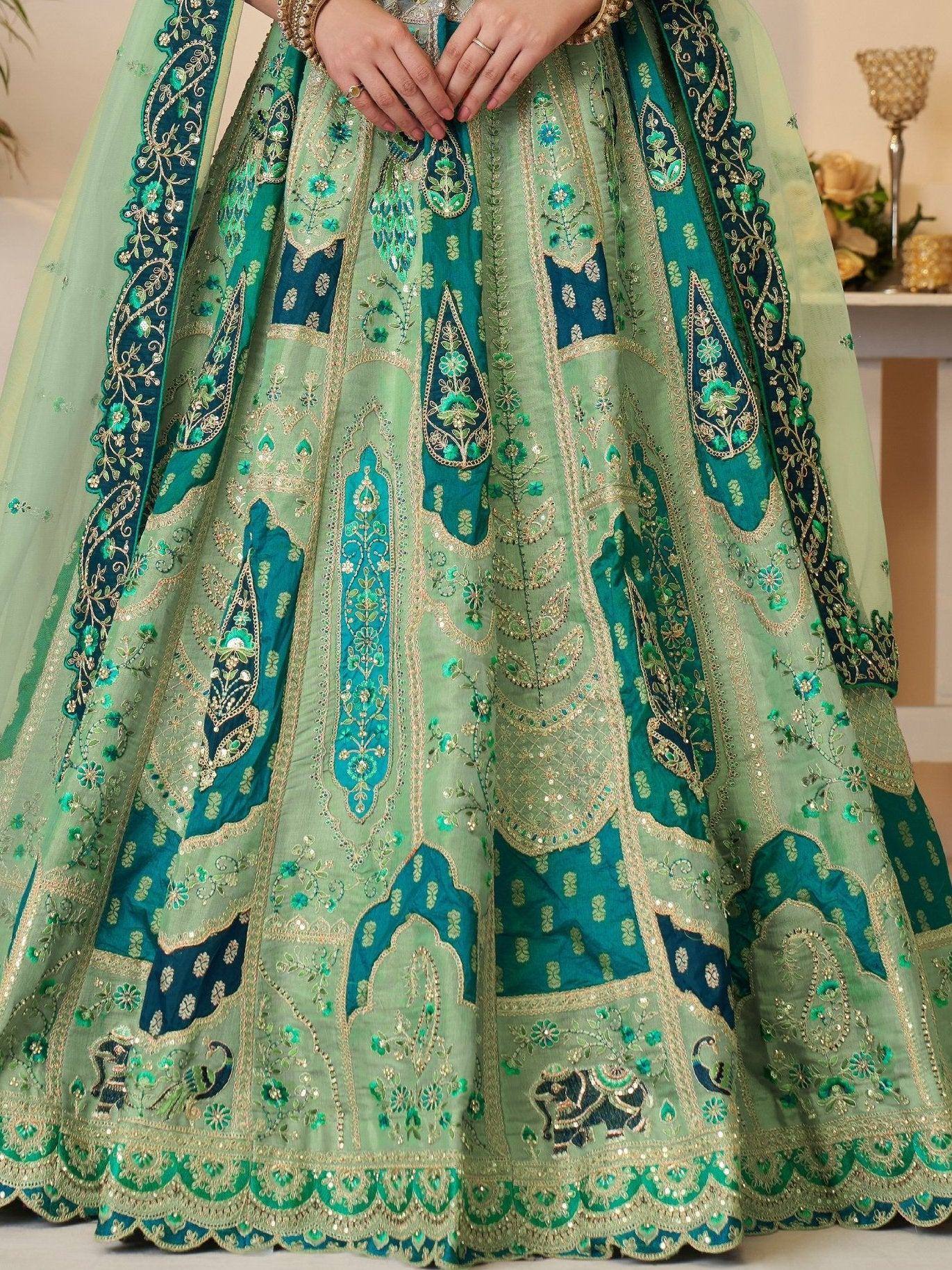 Emerald green designer lehenga with intricate gold embroidery and paisley motifs, perfect for Indian weddings.