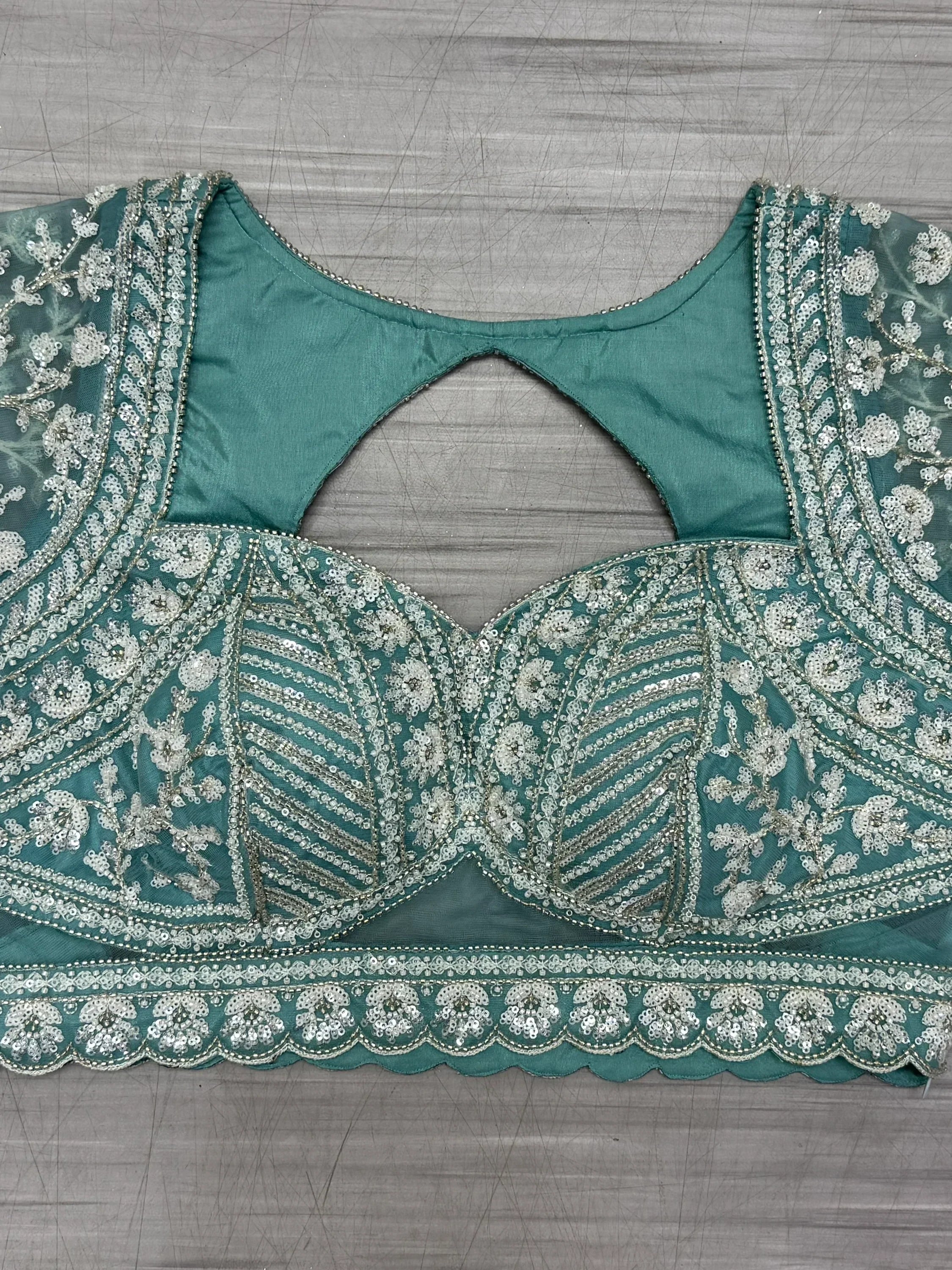 Teal green embroidered blouse with silver sequin floral work, perfect for lehenga choli or saree