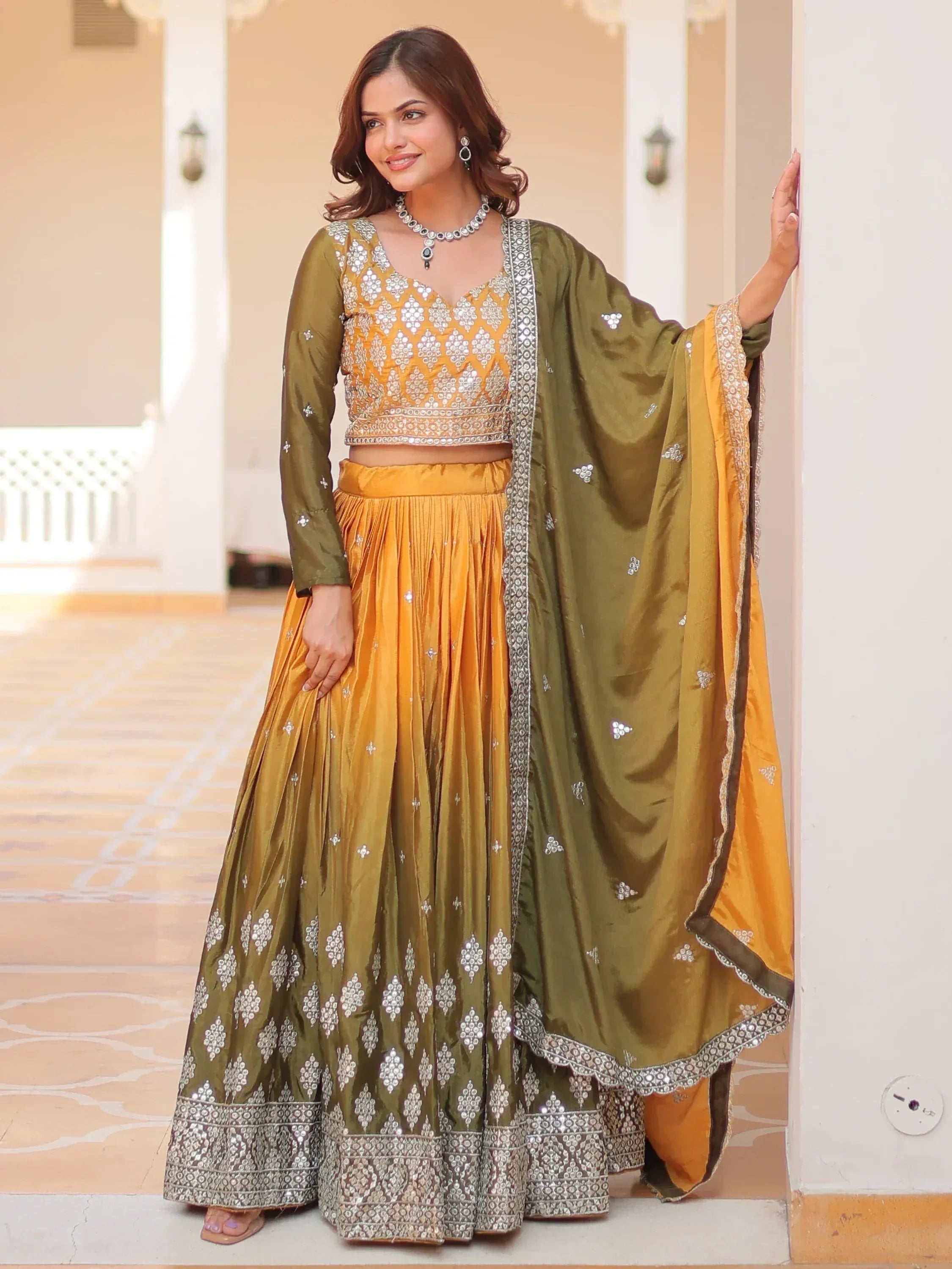 Olive and mustard yellow designer lehenga choli with mirror work and dupatta, perfect for Indian ethnic occasions.