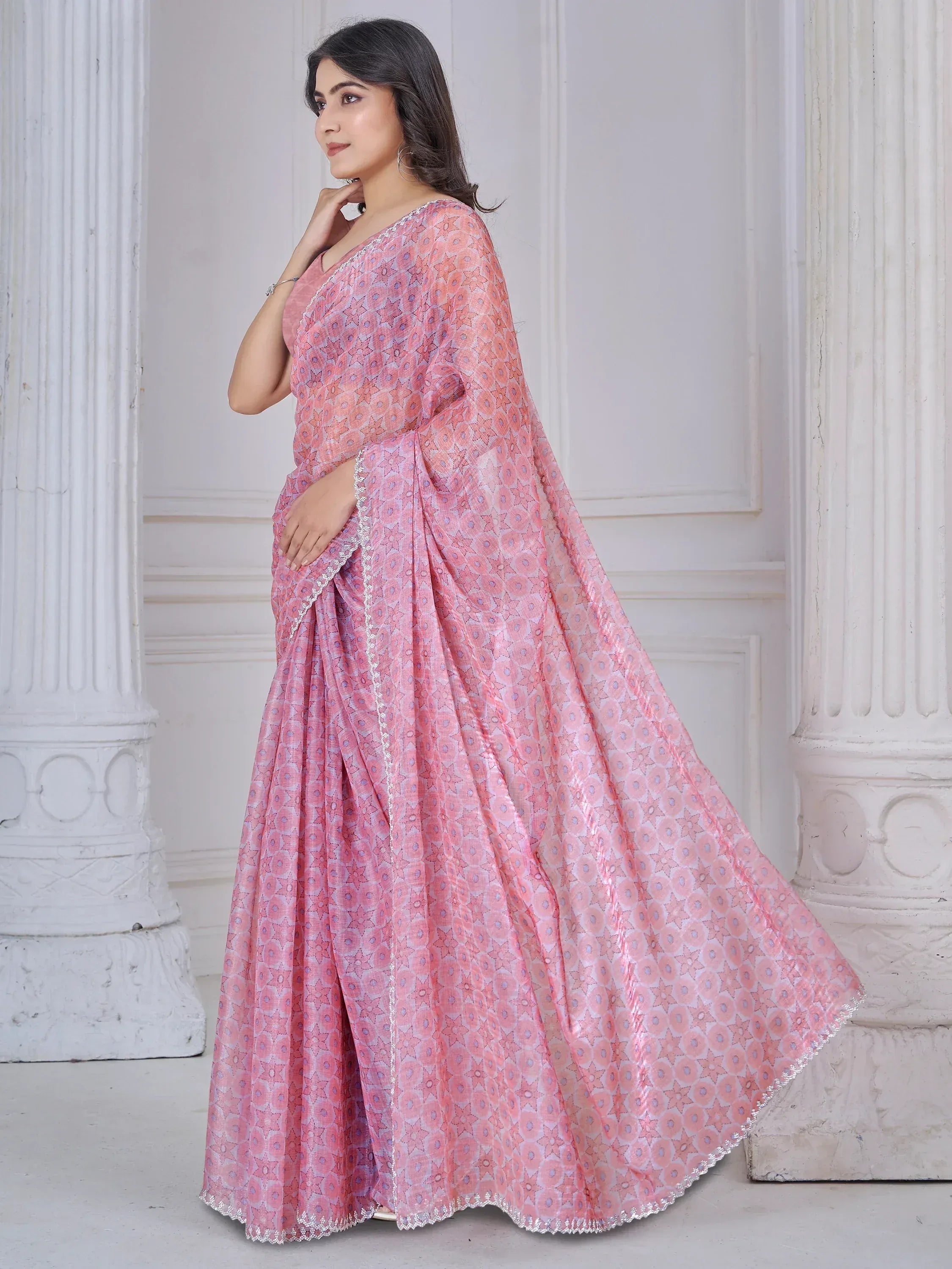 Pink printed ethnic saree with lace trim, perfect for Indian occasions and festive wear