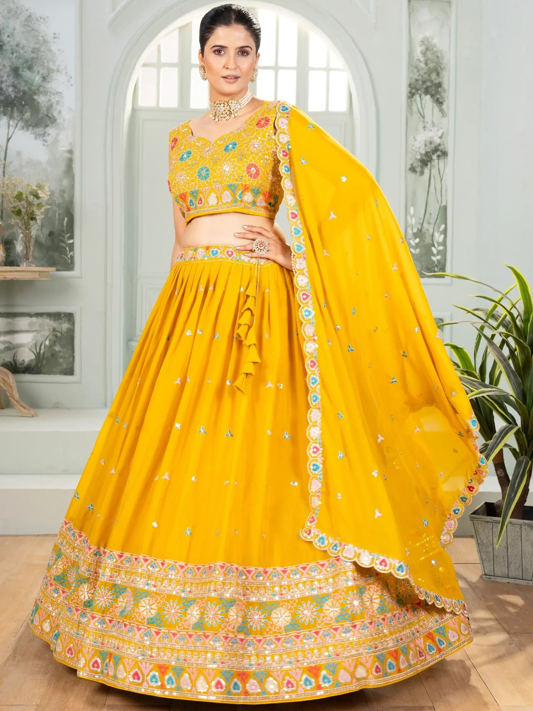 Yellow embroidered lehenga choli with floral motifs and dupatta, Indian ethnic wear for women