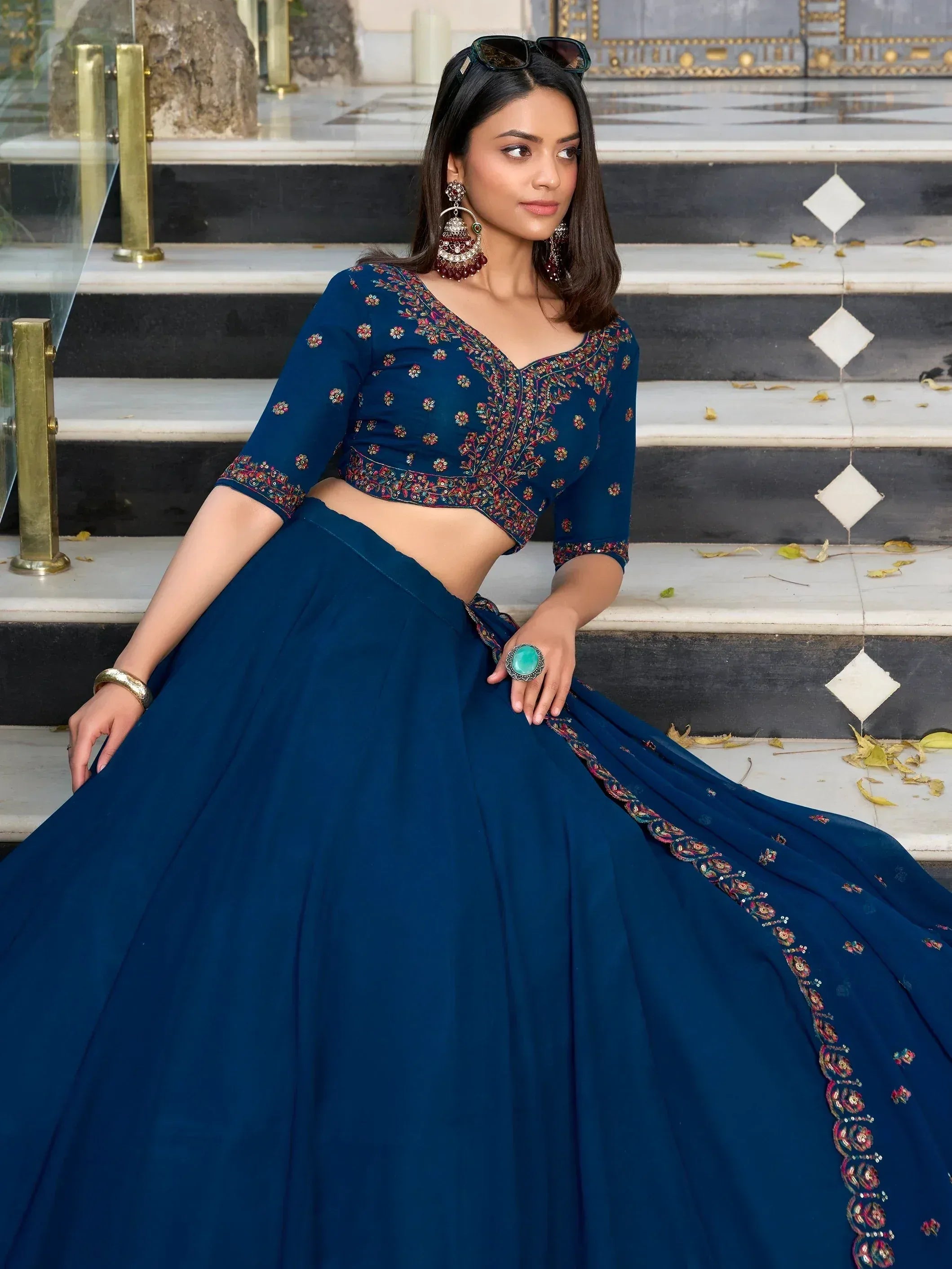 Blue embroidered lehenga choli with floral detailing, perfect for Indian ethnic wear and festive occasions.