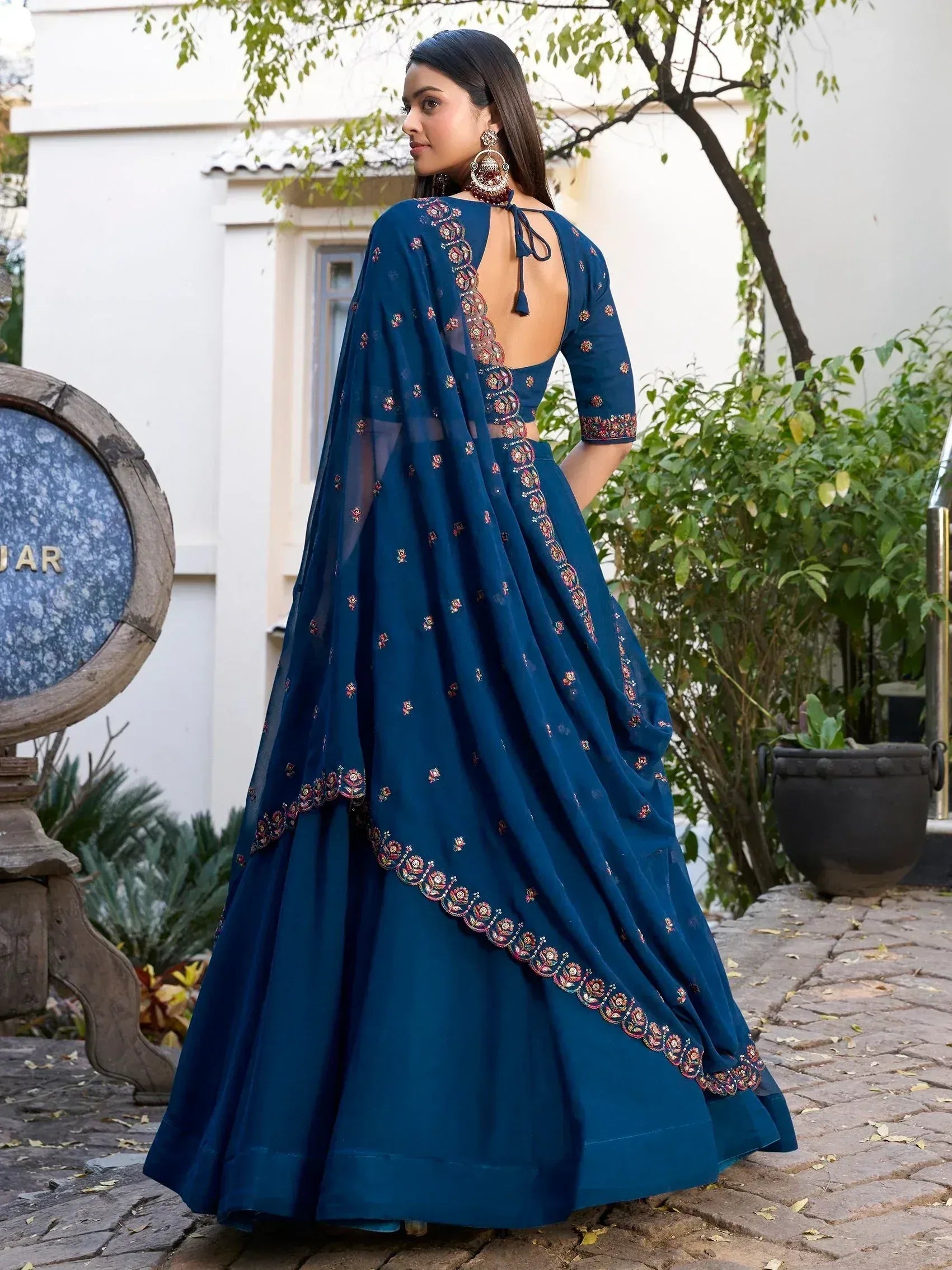 Blue embroidered lehenga choli with back tie detail, perfect for Indian ethnic wear occasions