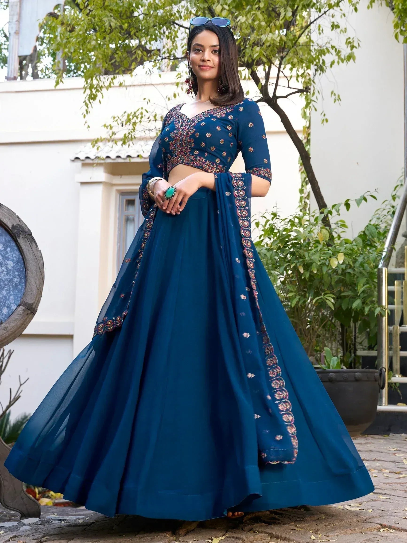Blue embroidered lehenga choli with floral detailing, perfect for Indian ethnic wear occasions