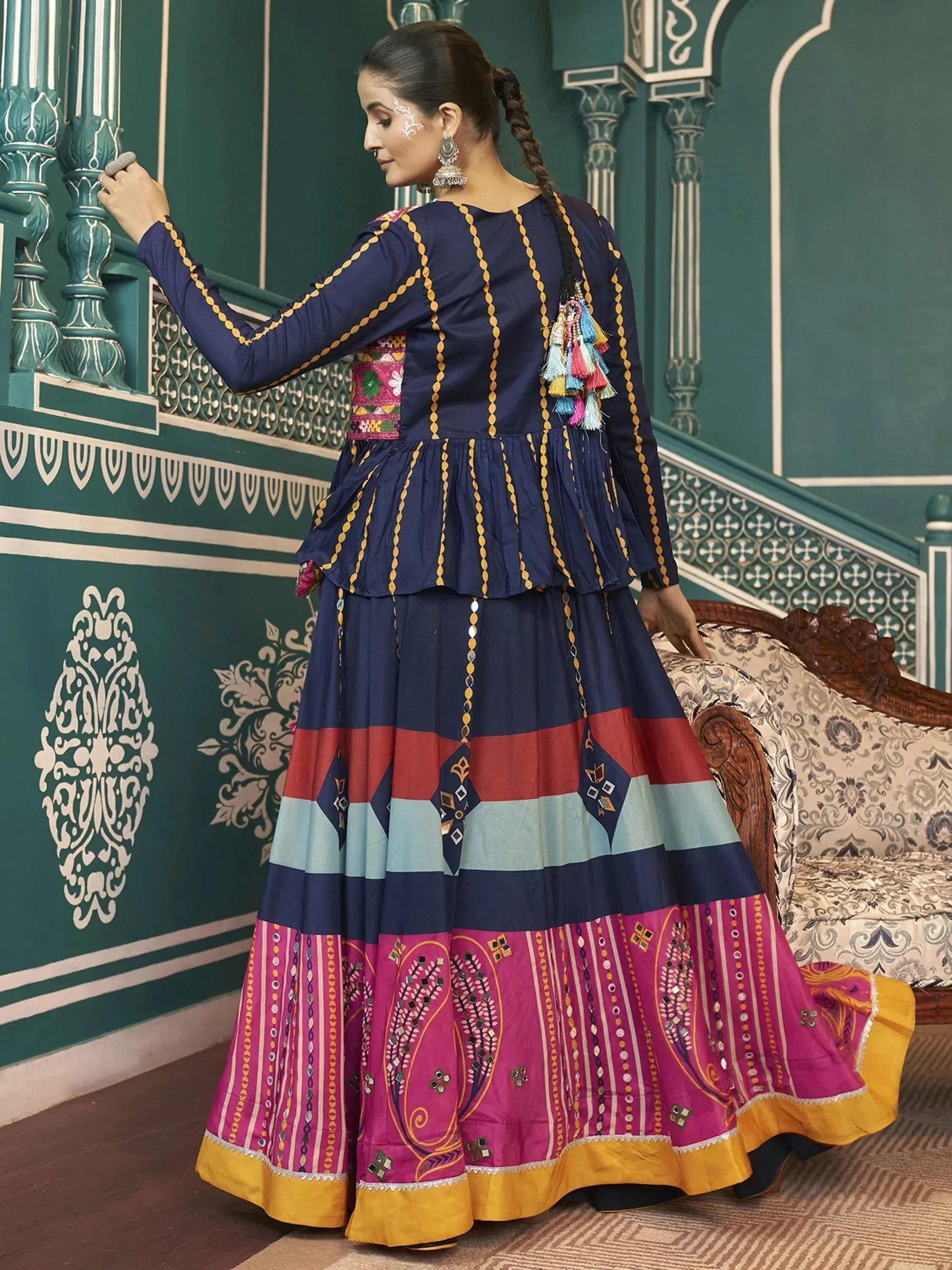 Elegant Indian ethnic gown with colorful stripes and embroidery, perfect for festive occasions.