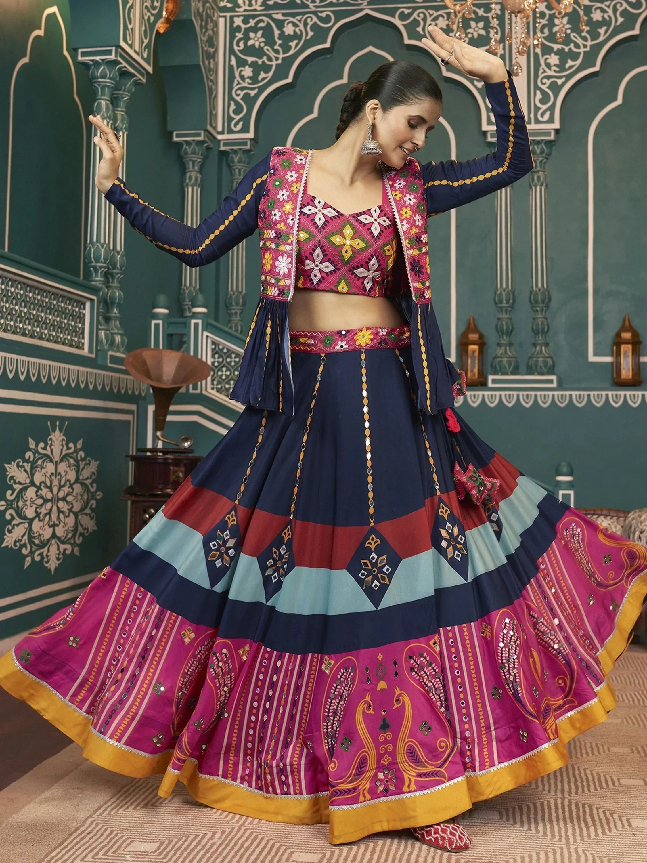 Vibrant Indian ethnic lehenga choli with floral embroidery and mirror work, perfect for festive occasions.
