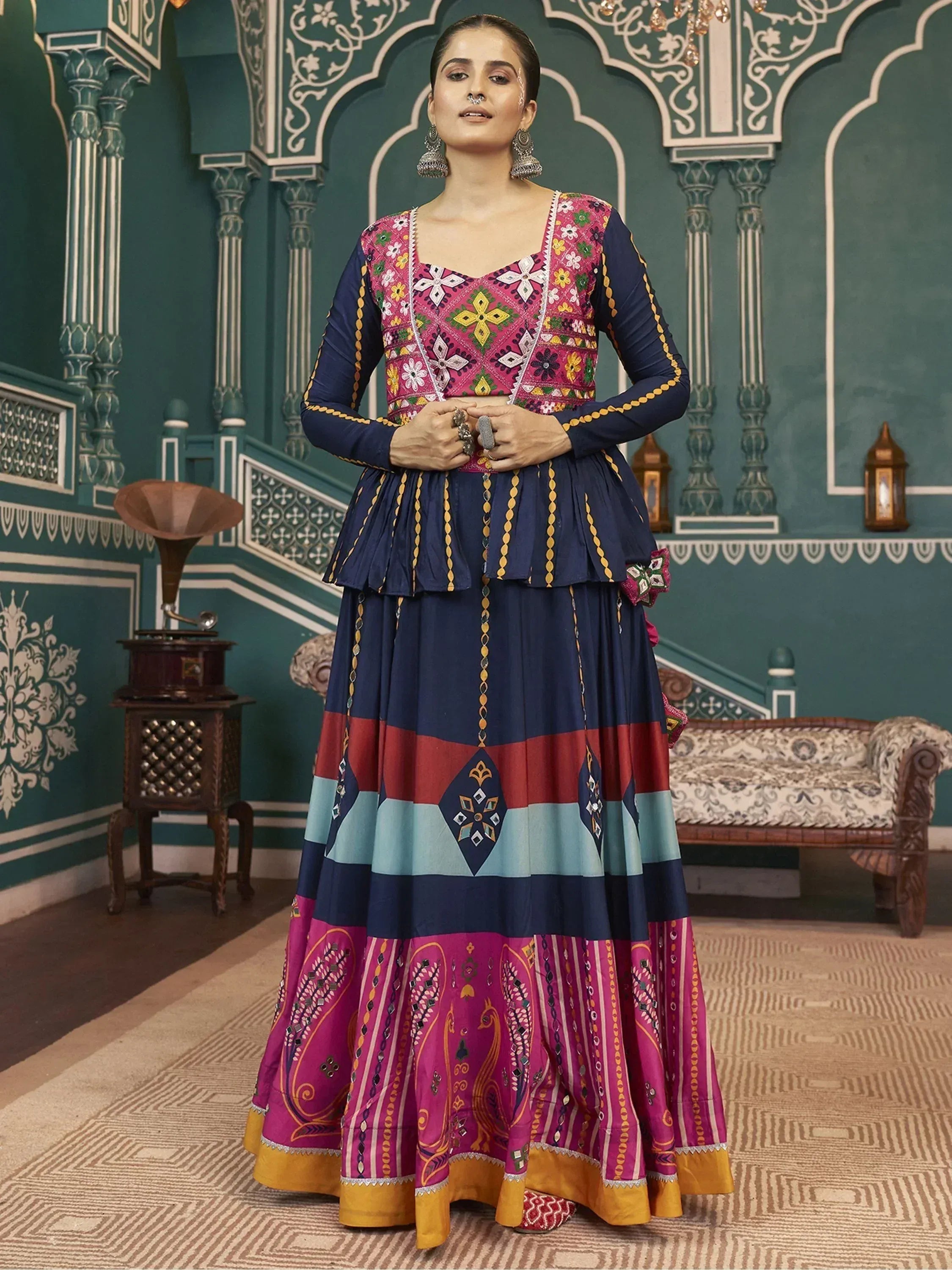 Colorful embroidered ethnic gown with floral patterns and layered skirt for festive occasions
