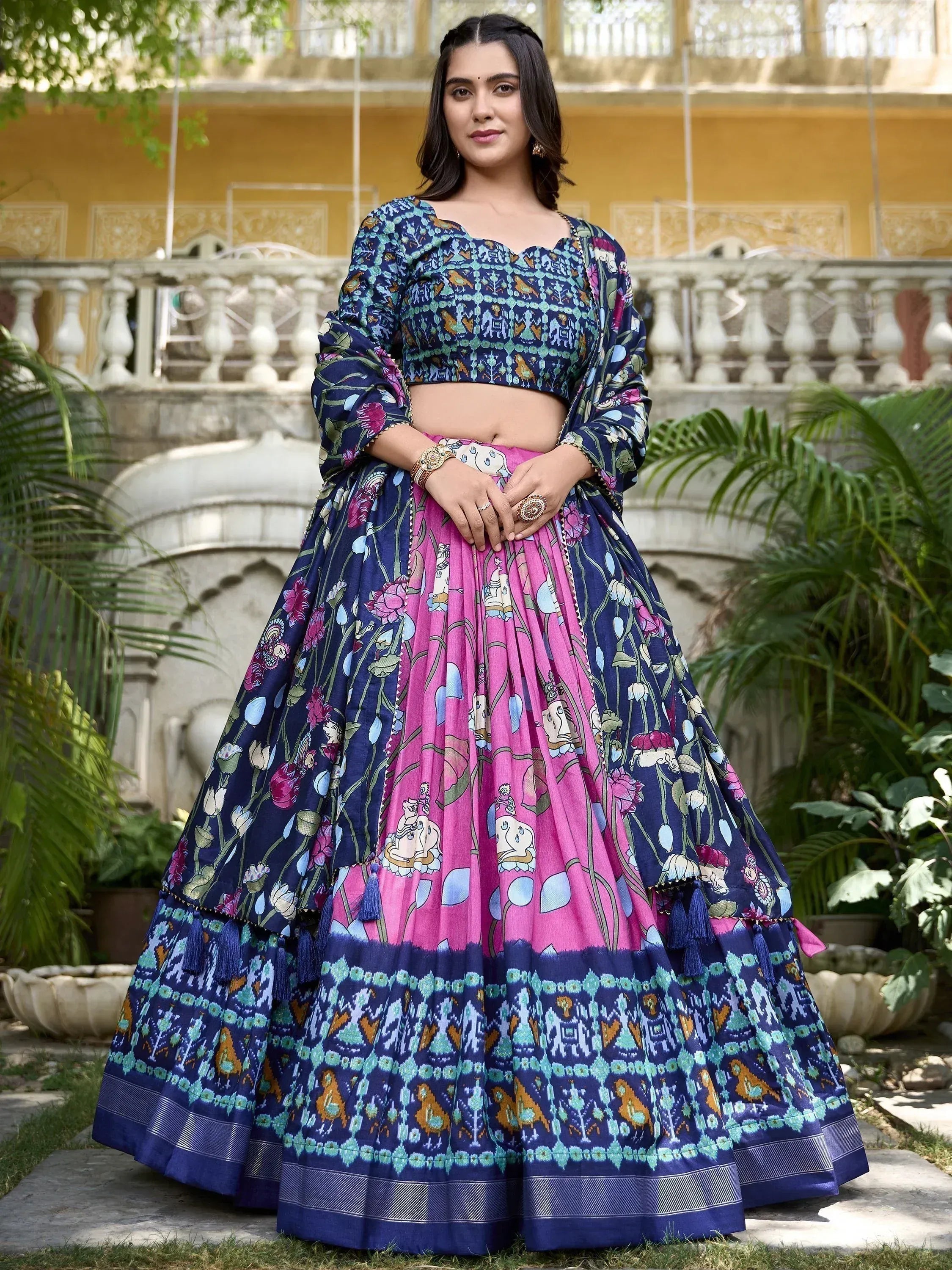 Woman in floral print blue and pink lehenga choli, Indian ethnic wear for festive occasions