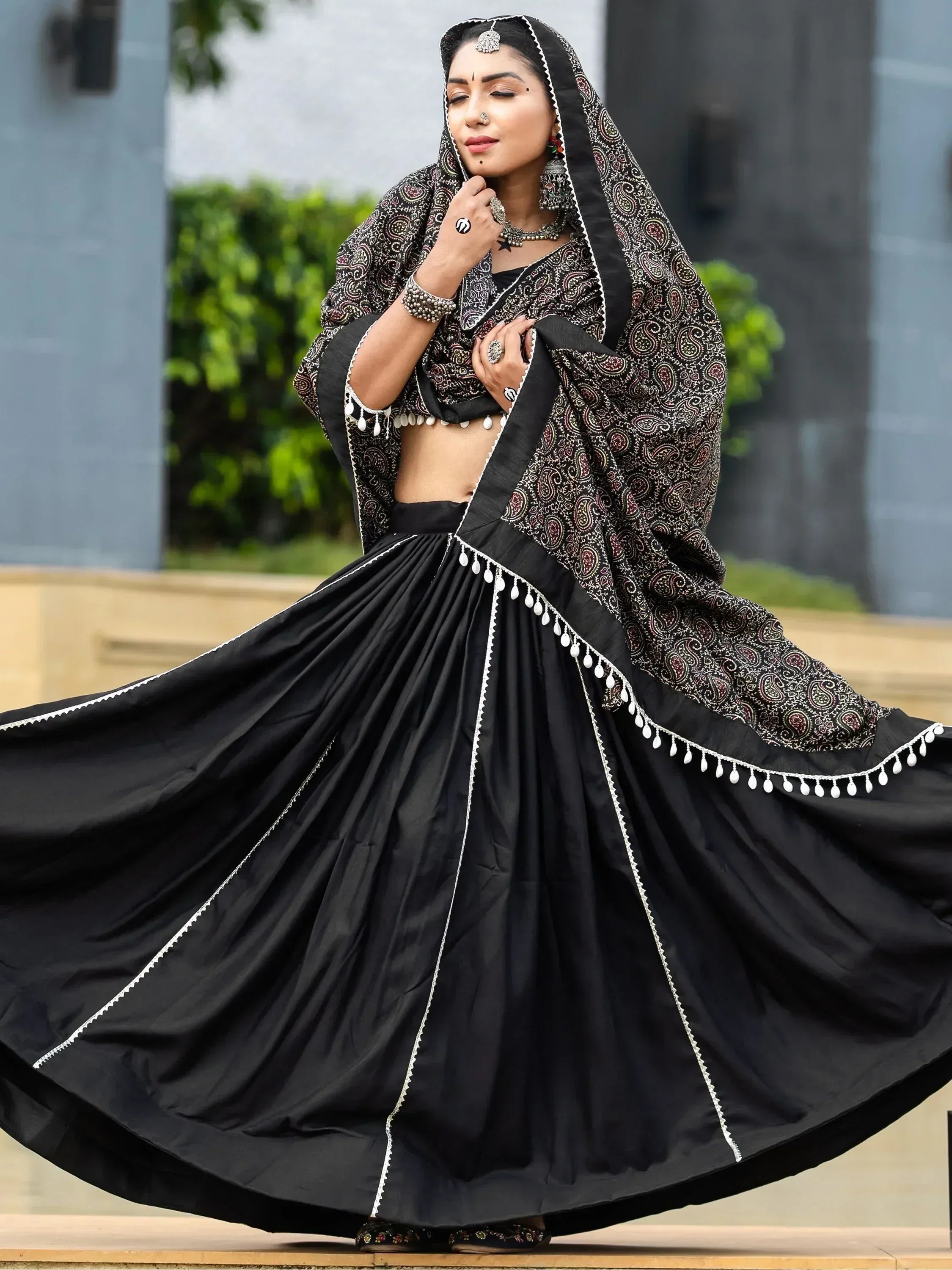 Black ethnic lehenga choli with paisley dupatta, perfect for Indian weddings or festive occasions