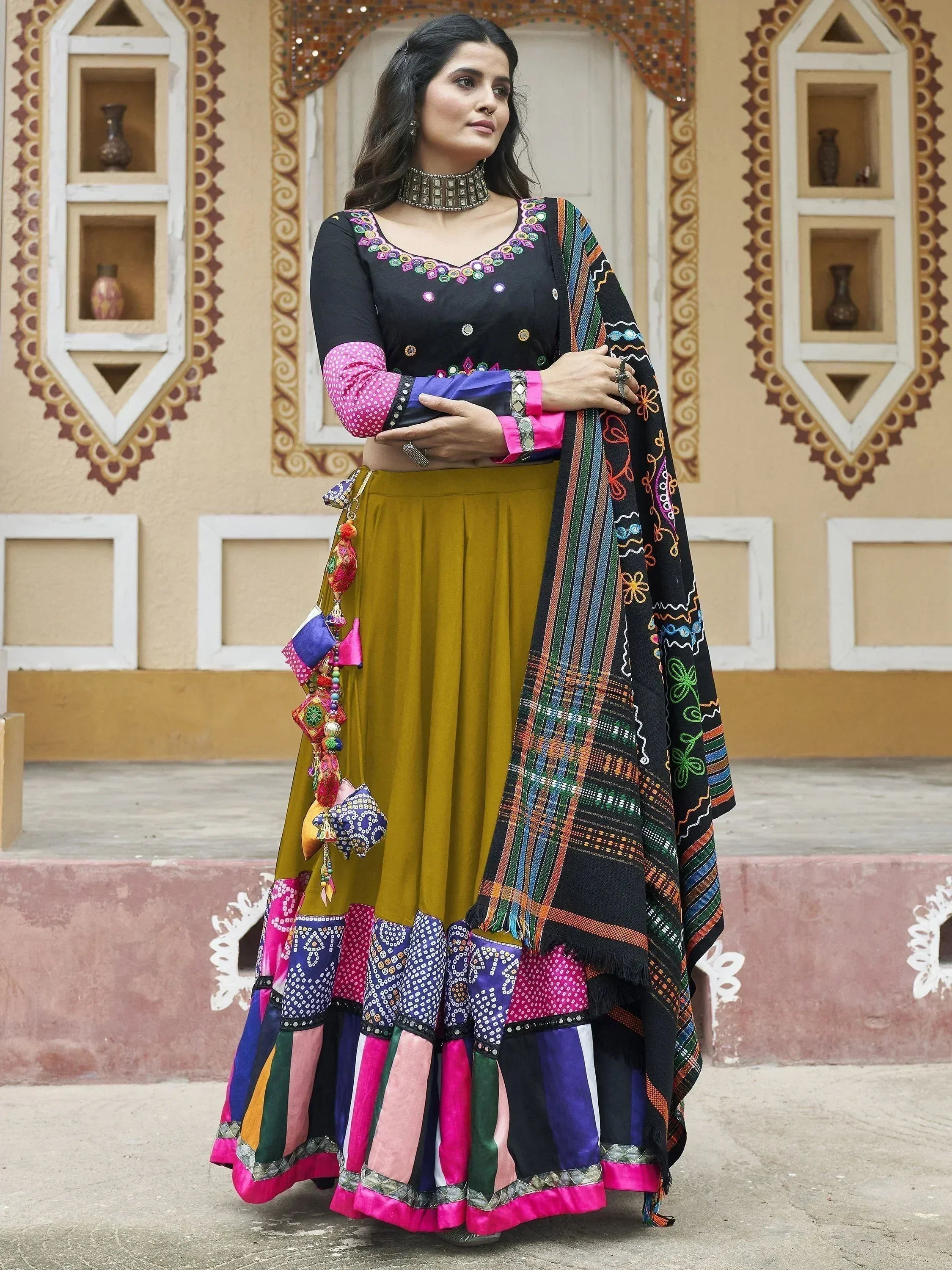 Black embroidered top with mustard yellow lehenga and colorful dupatta, Indian ethnic wear