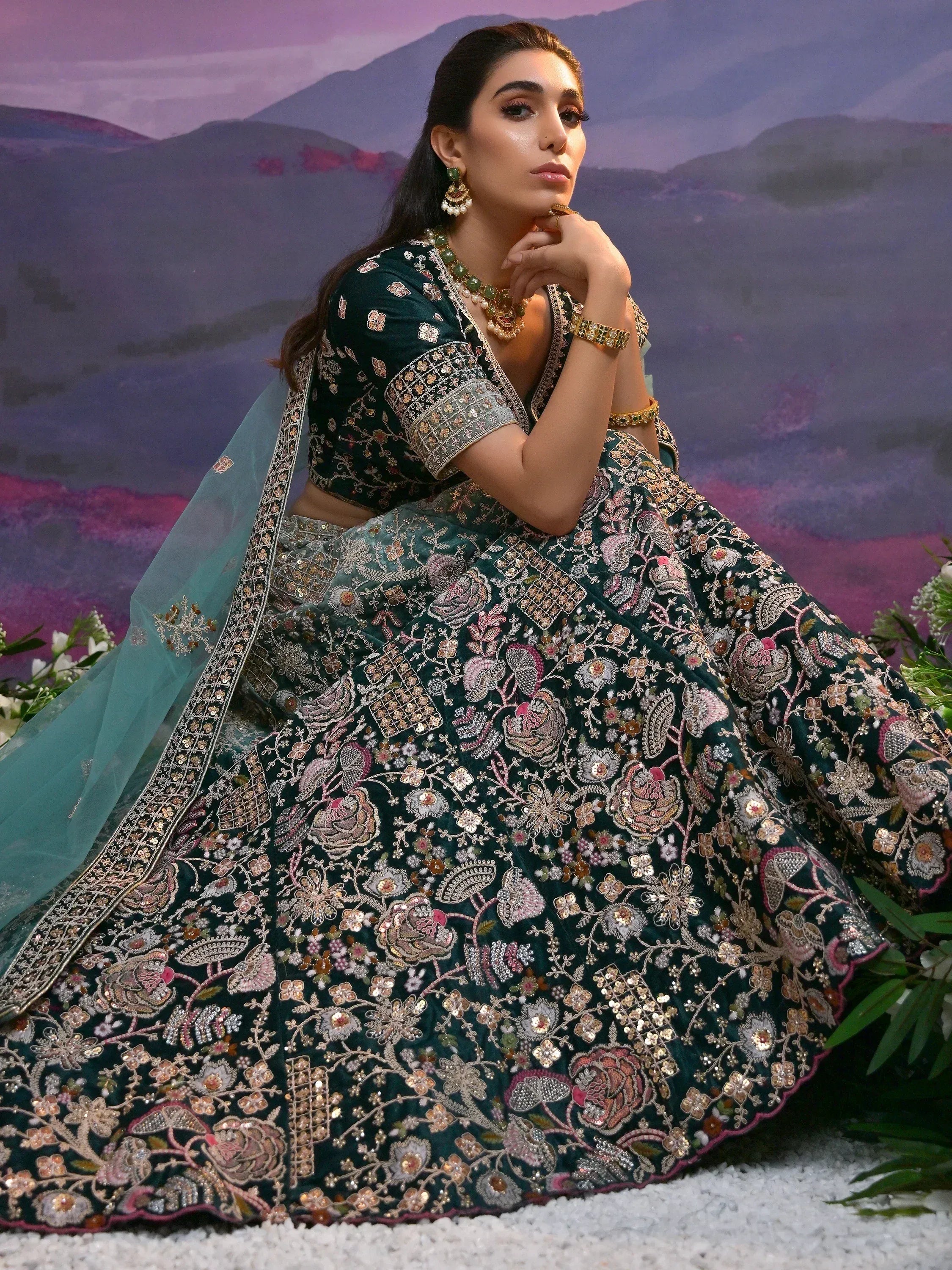 Elegant emerald green embroidered lehenga choli with floral motifs and dupatta, perfect for Indian weddings and festive occasions.
