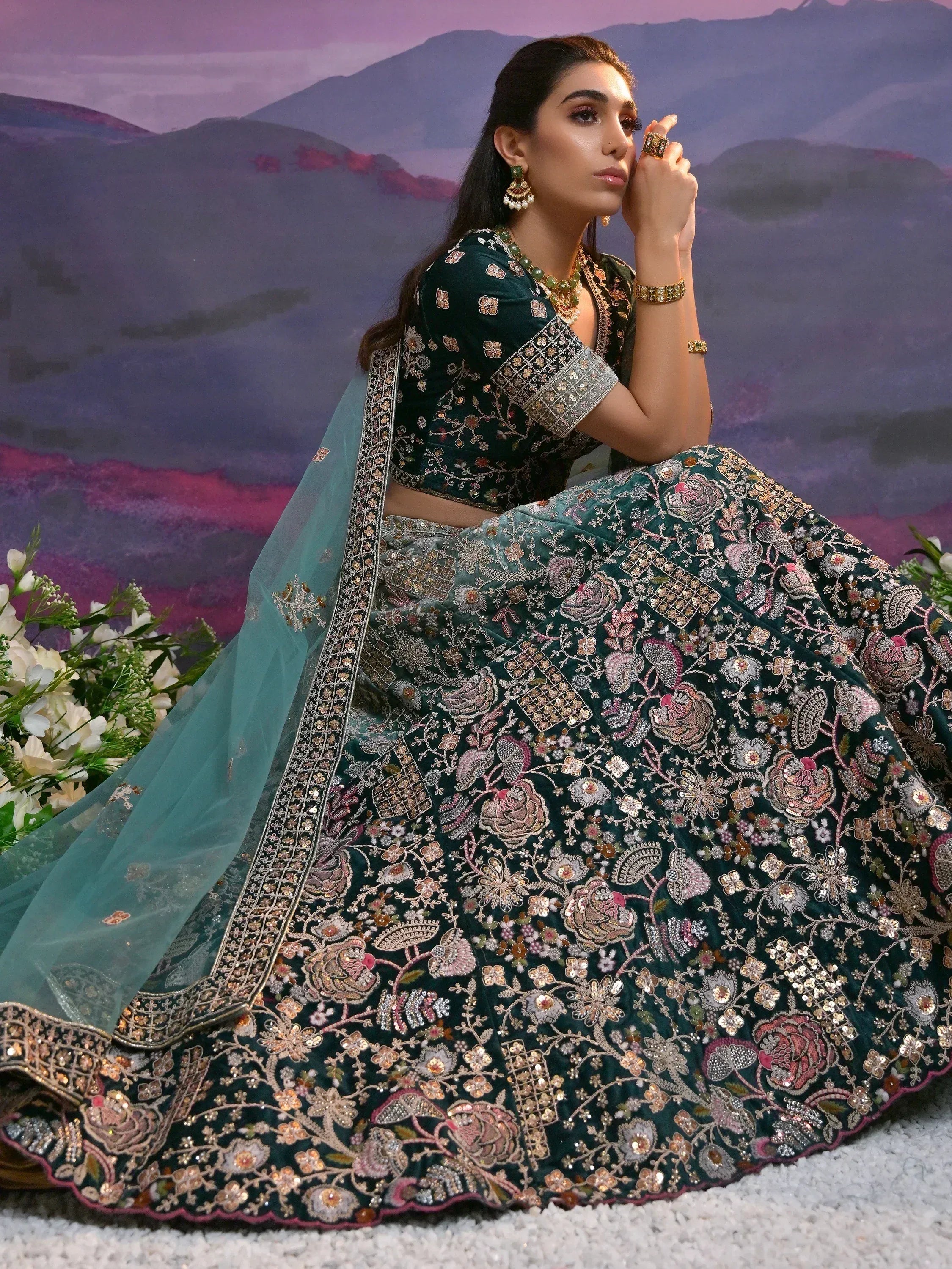 Emerald green embroidered lehenga choli with floral motifs, perfect for Indian weddings and festive occasions.