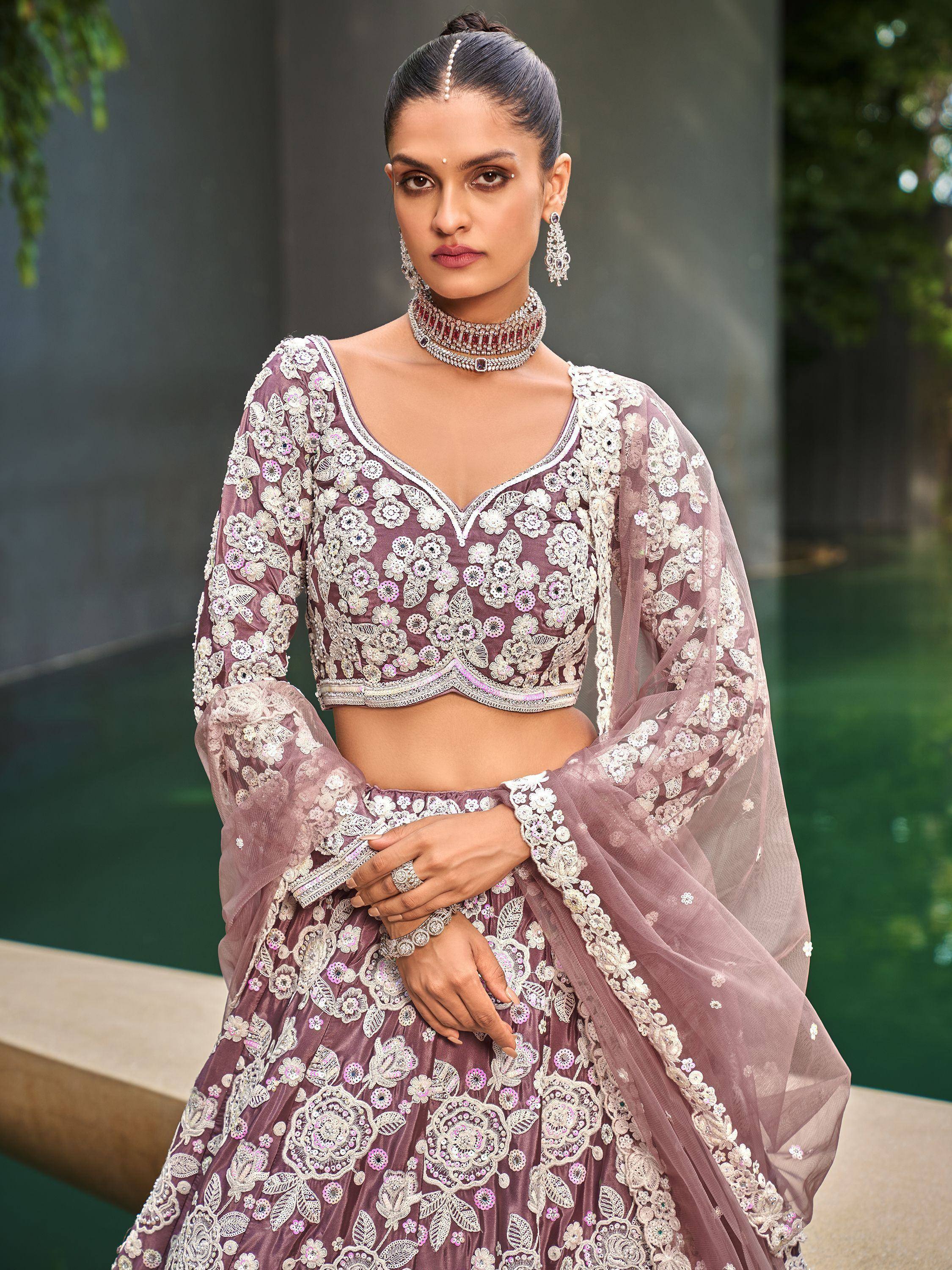 Elegant mauve lehenga choli with floral embroidery, perfect for Indian weddings and festive occasions.