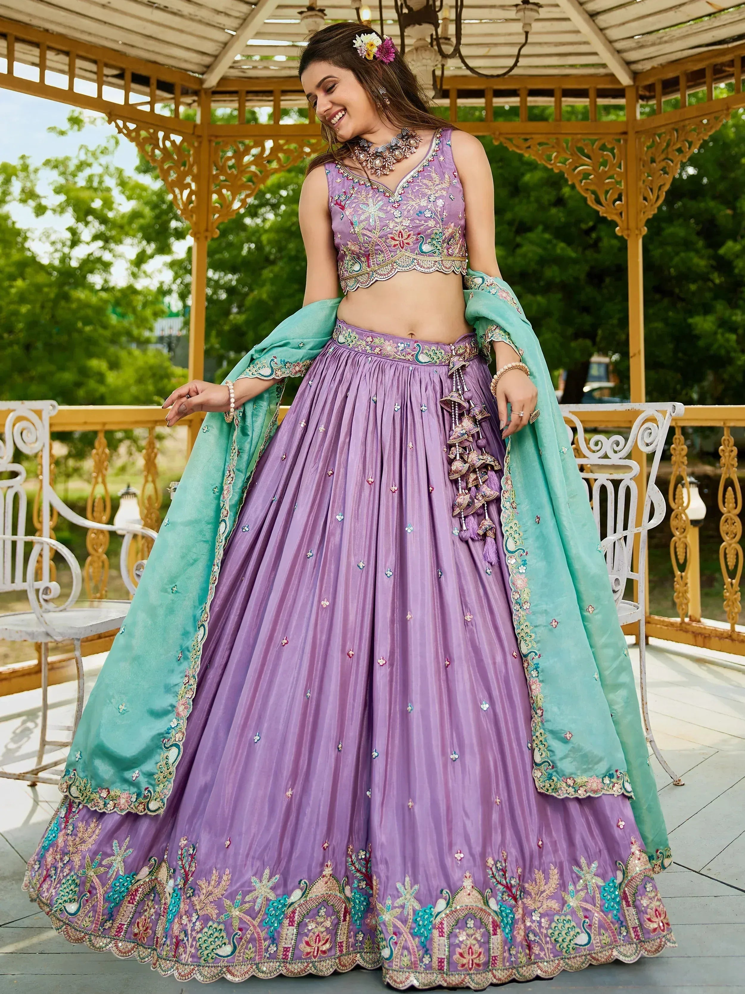Lavender embroidered lehenga choli with peacock motifs and mint dupatta, perfect for Indian ethnic wear occasions.