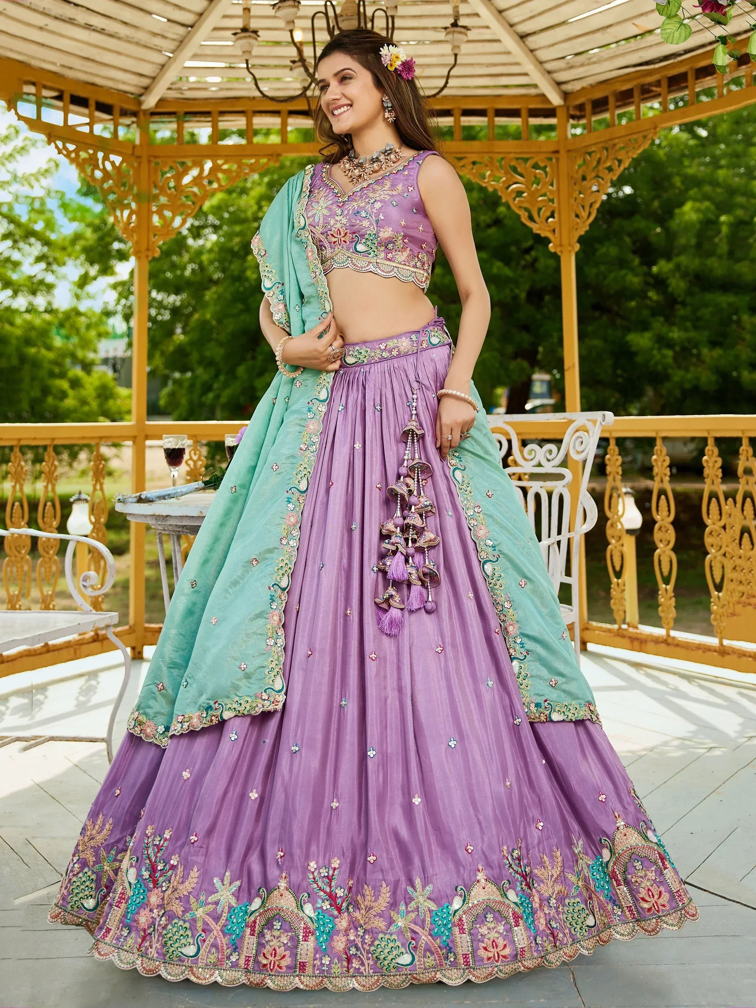 Purple and mint designer lehenga choli with floral embroidery and peacock motifs, perfect for Indian ethnic wear.