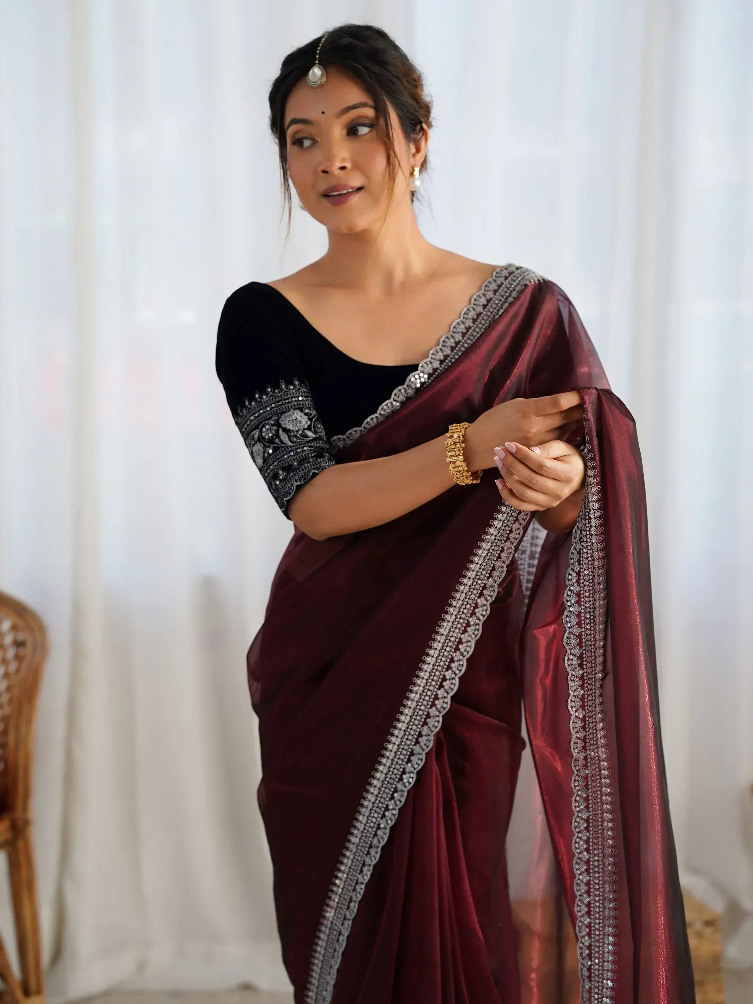 Elegant maroon velvet saree with silver embroidery, paired with black blouse for Indian ethnic wear