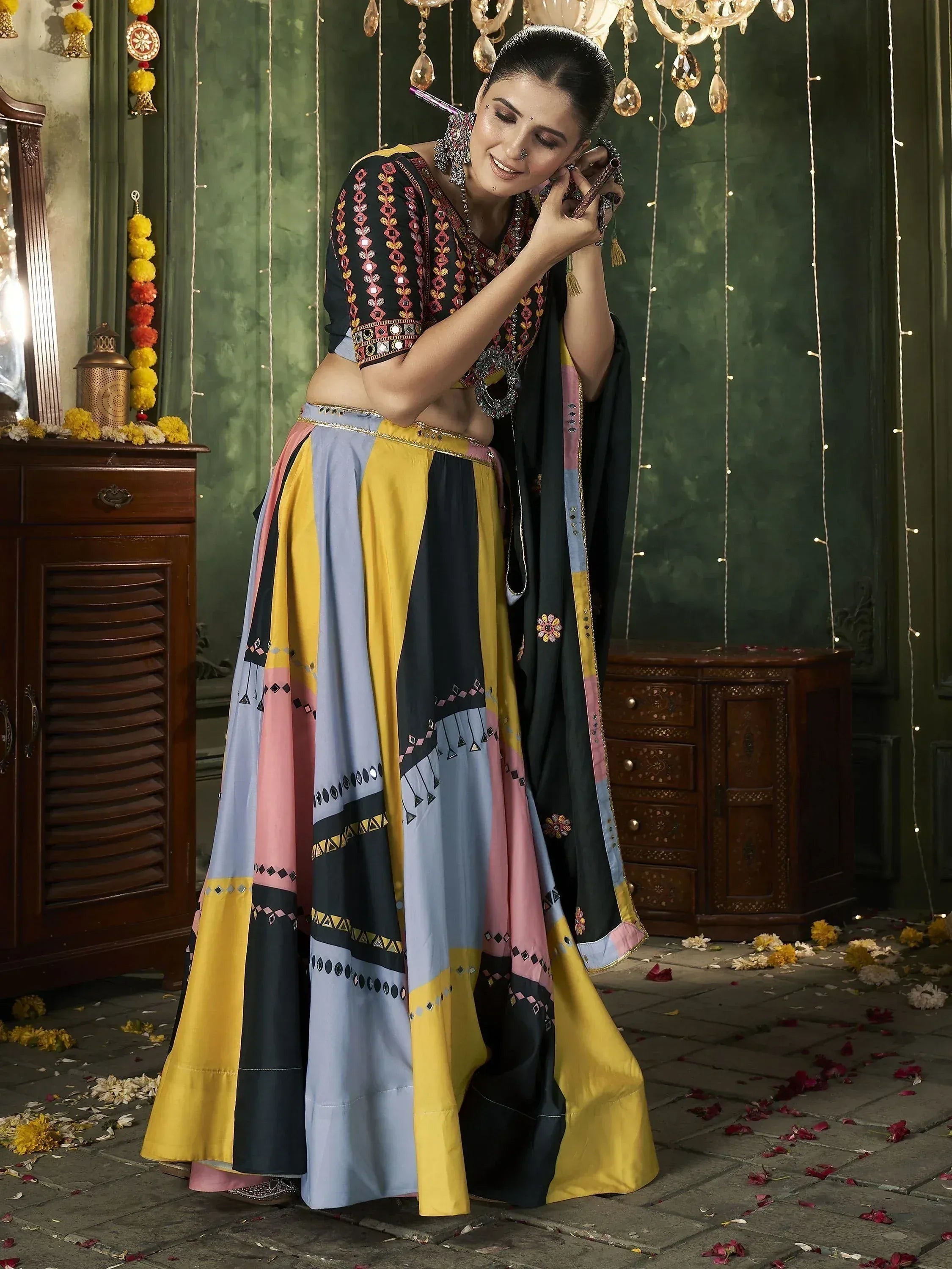 Colorful ethnic lehenga choli with mirror work and floral dupatta for festive occasions