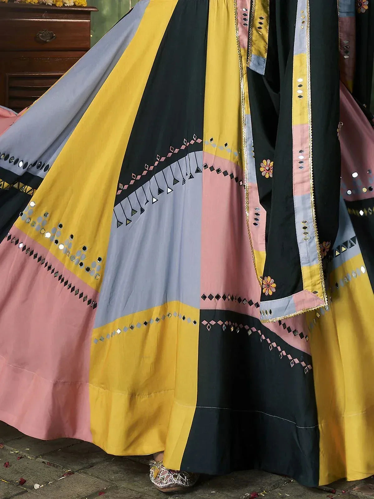 Colorful patchwork lehenga with mirror work and geometric embroidery in yellow, pink, grey, black