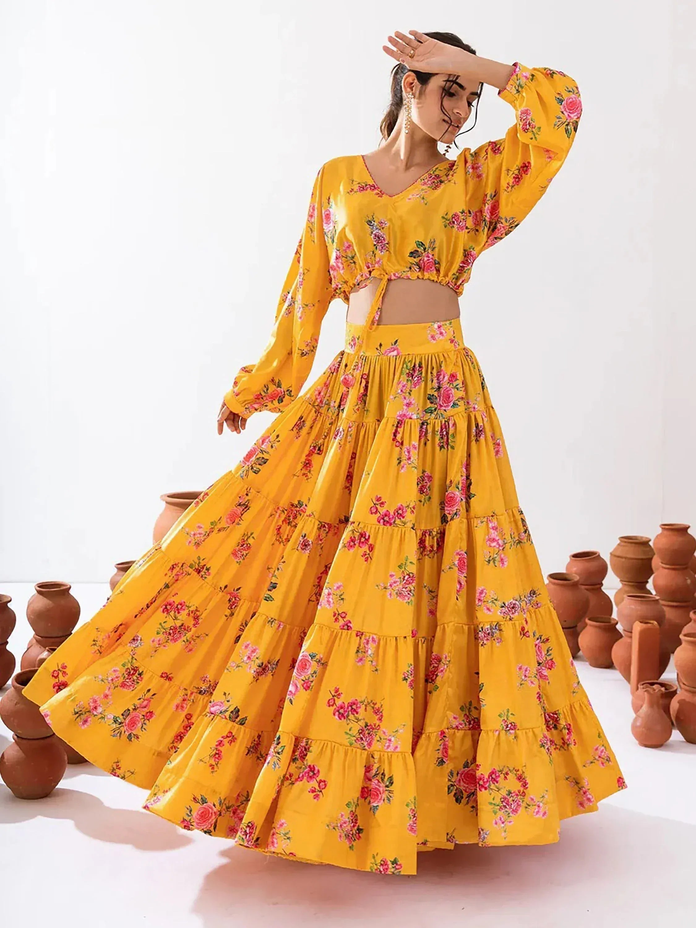 Yellow floral lehenga choli with tiered skirt and puff sleeves, perfect for ethnic occasions
