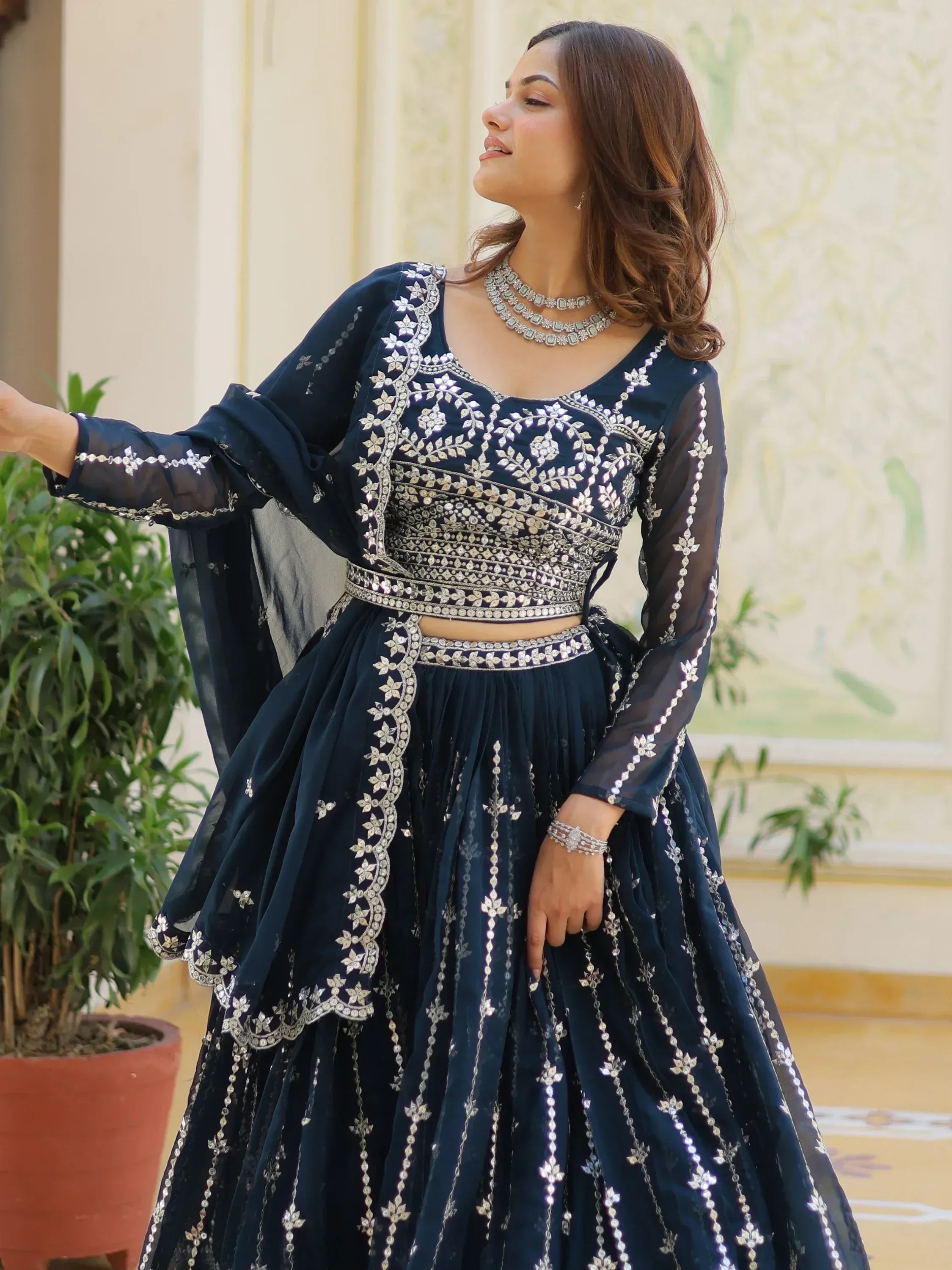 Navy blue embroidered lehenga choli with silver mirror work, perfect for Indian ethnic wear occasions