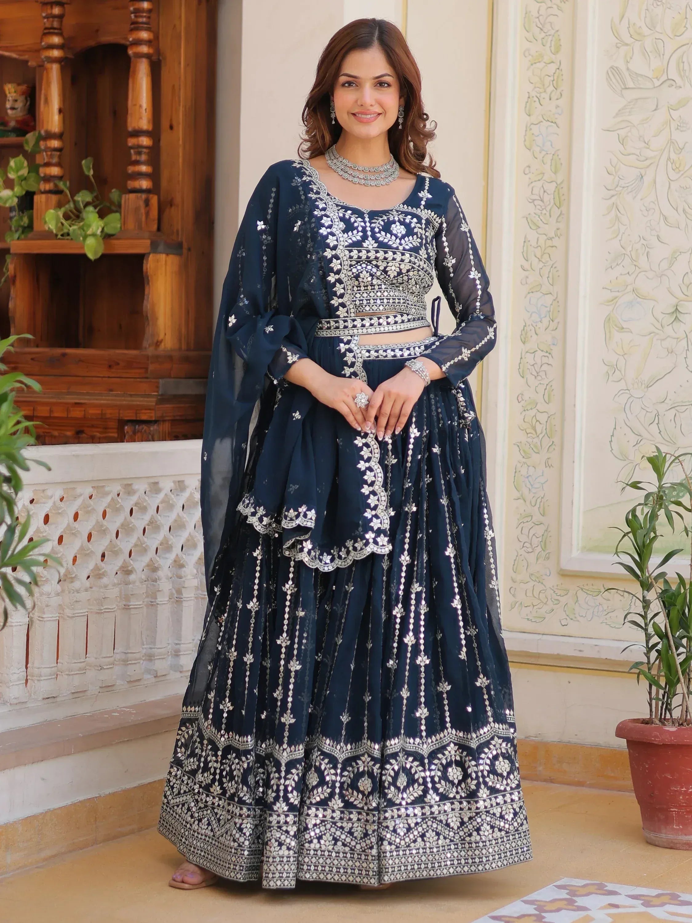 Navy blue designer lehenga choli with silver embroidery and mirror work, perfect for Indian ethnic occasions