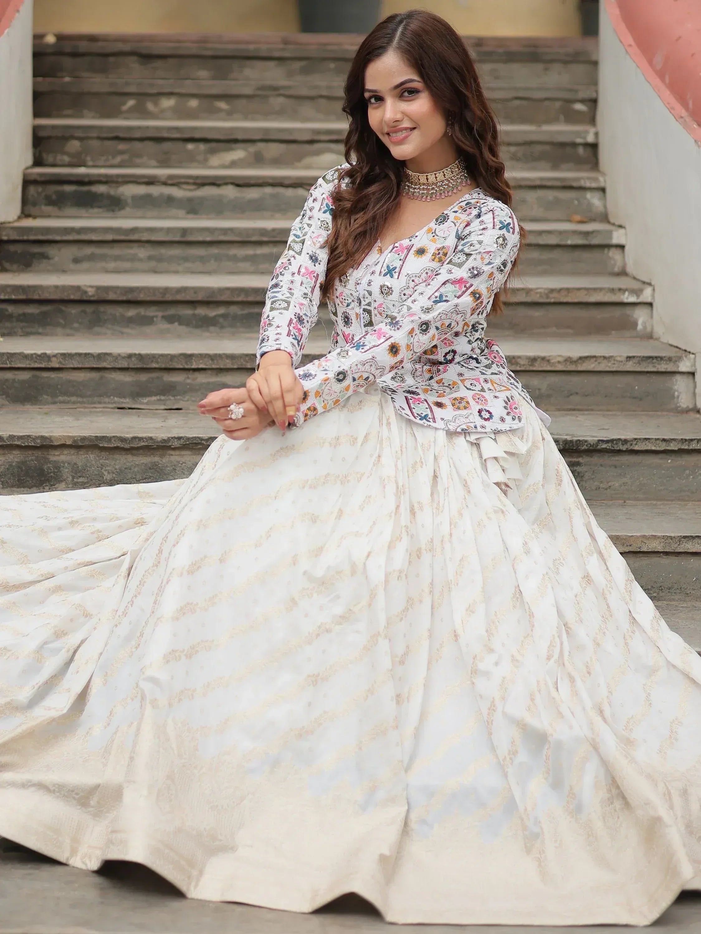 White floral embroidered lehenga choli with gold detailing, perfect for Indian ethnic occasions