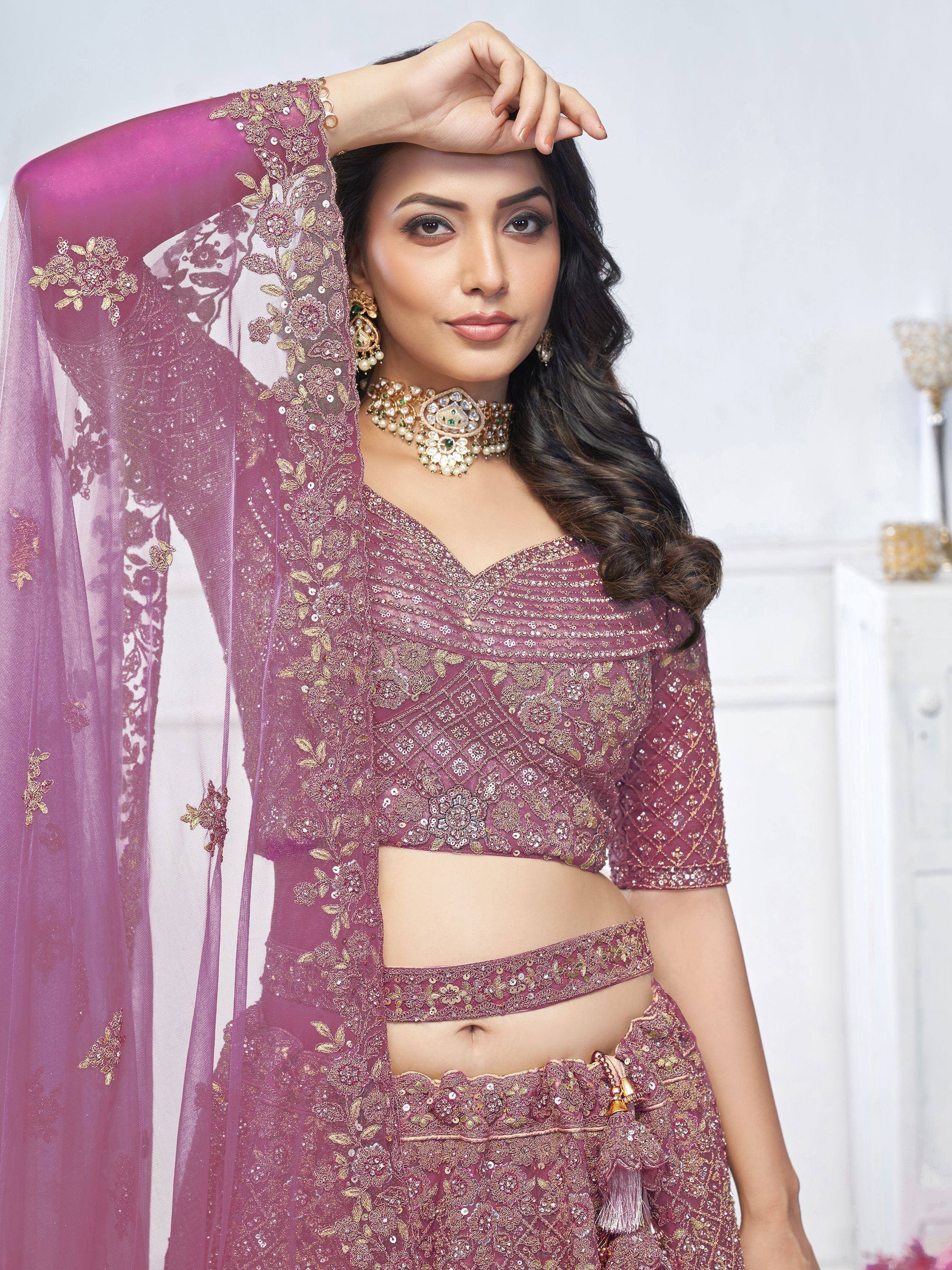 Elegant purple lehenga choli with gold embroidery and sequins, perfect for Indian ethnic wear events.
