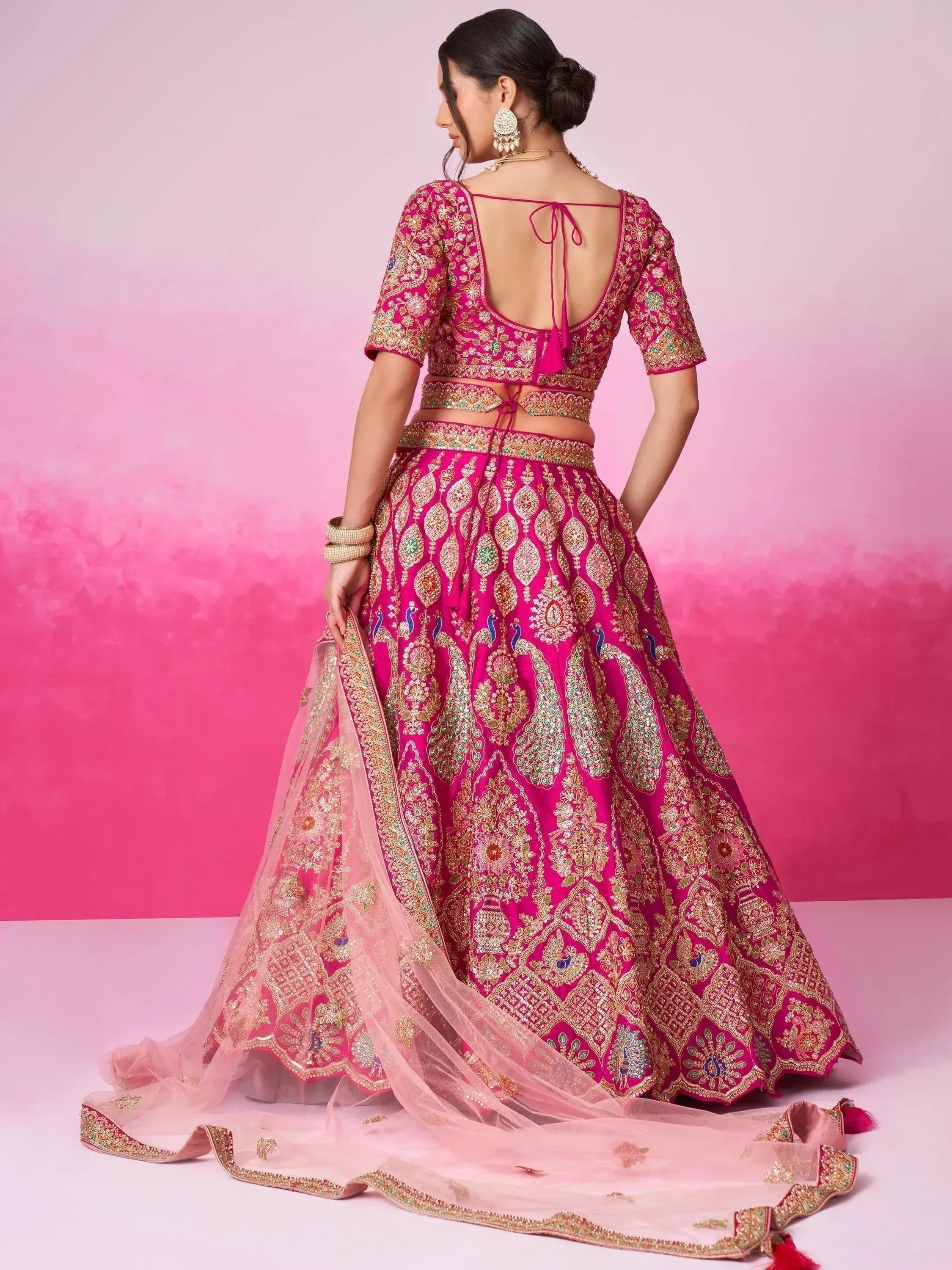 Pink embroidered lehenga choli with peacock motifs, back view, Indian ethnic wear